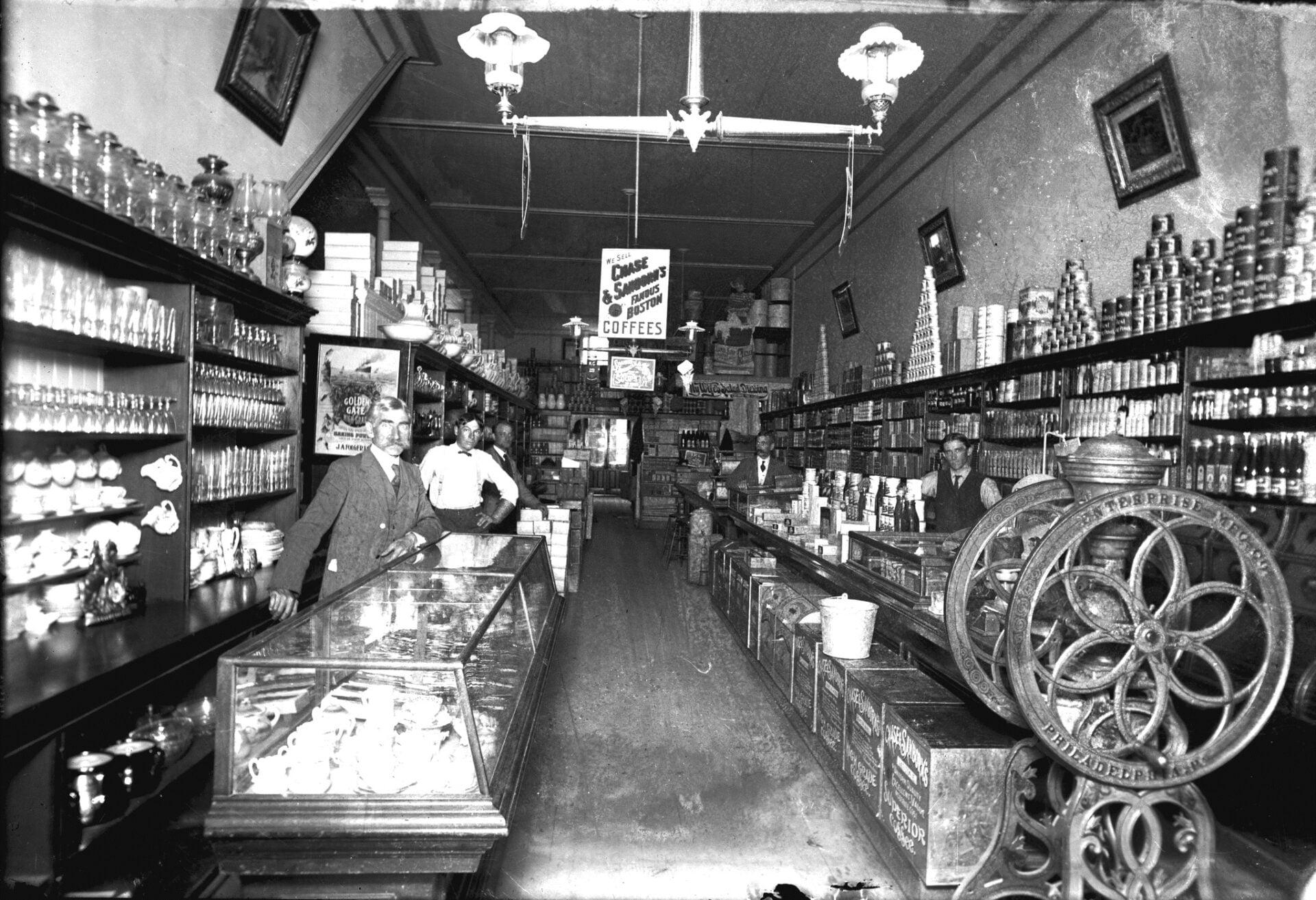 Vintage general store interior with clerks and shelves