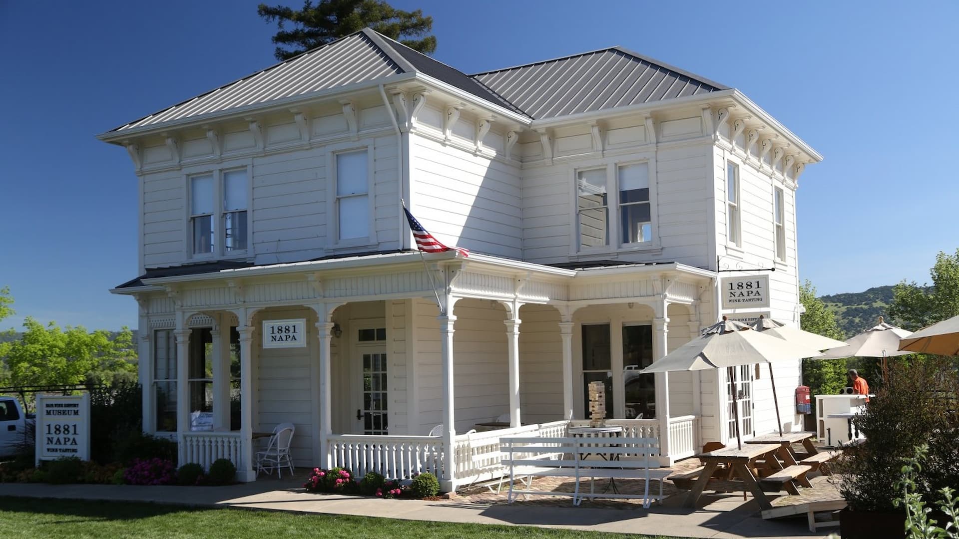 Historical white building with American flag.