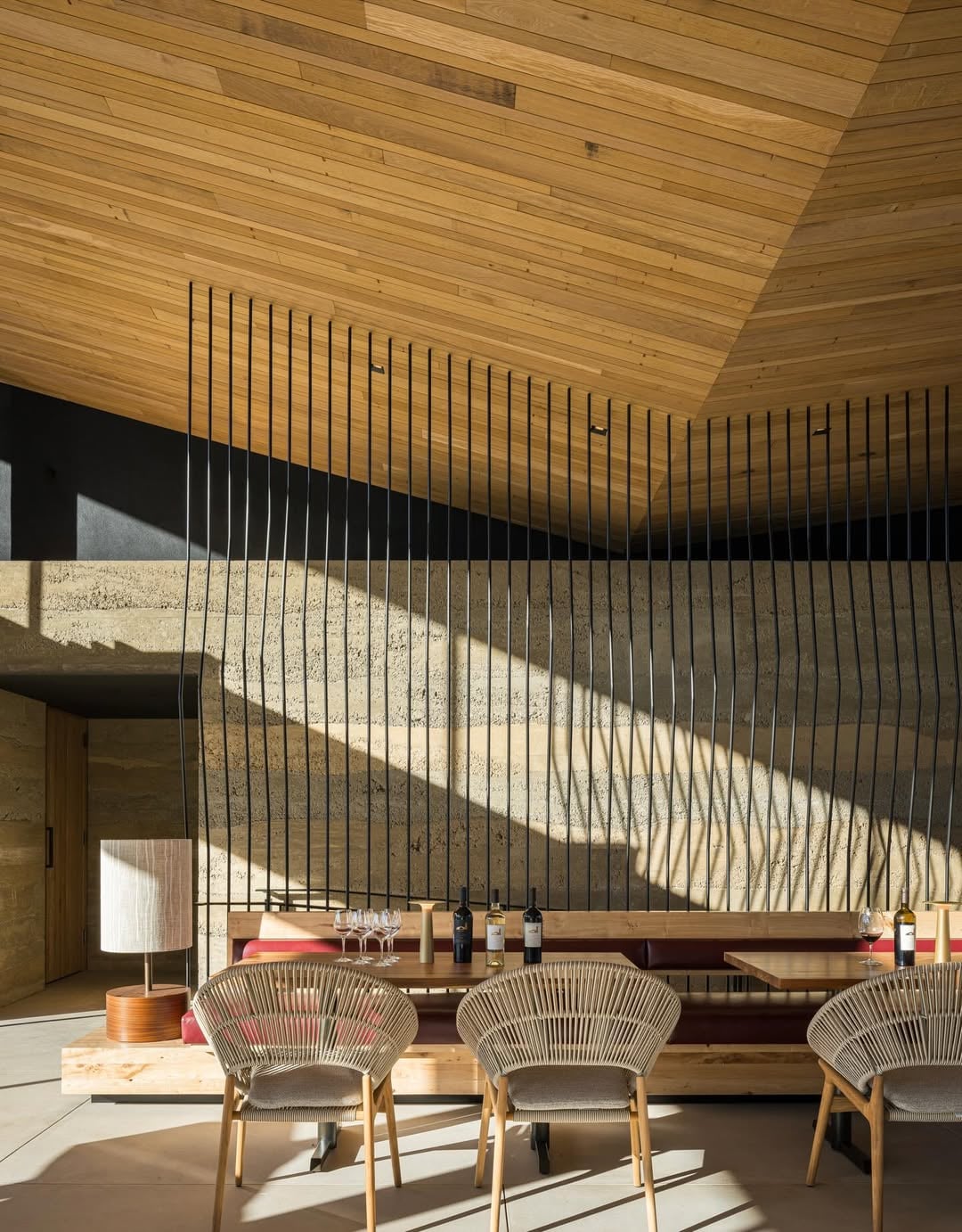 Modern dining area with wood ceiling and sunlight