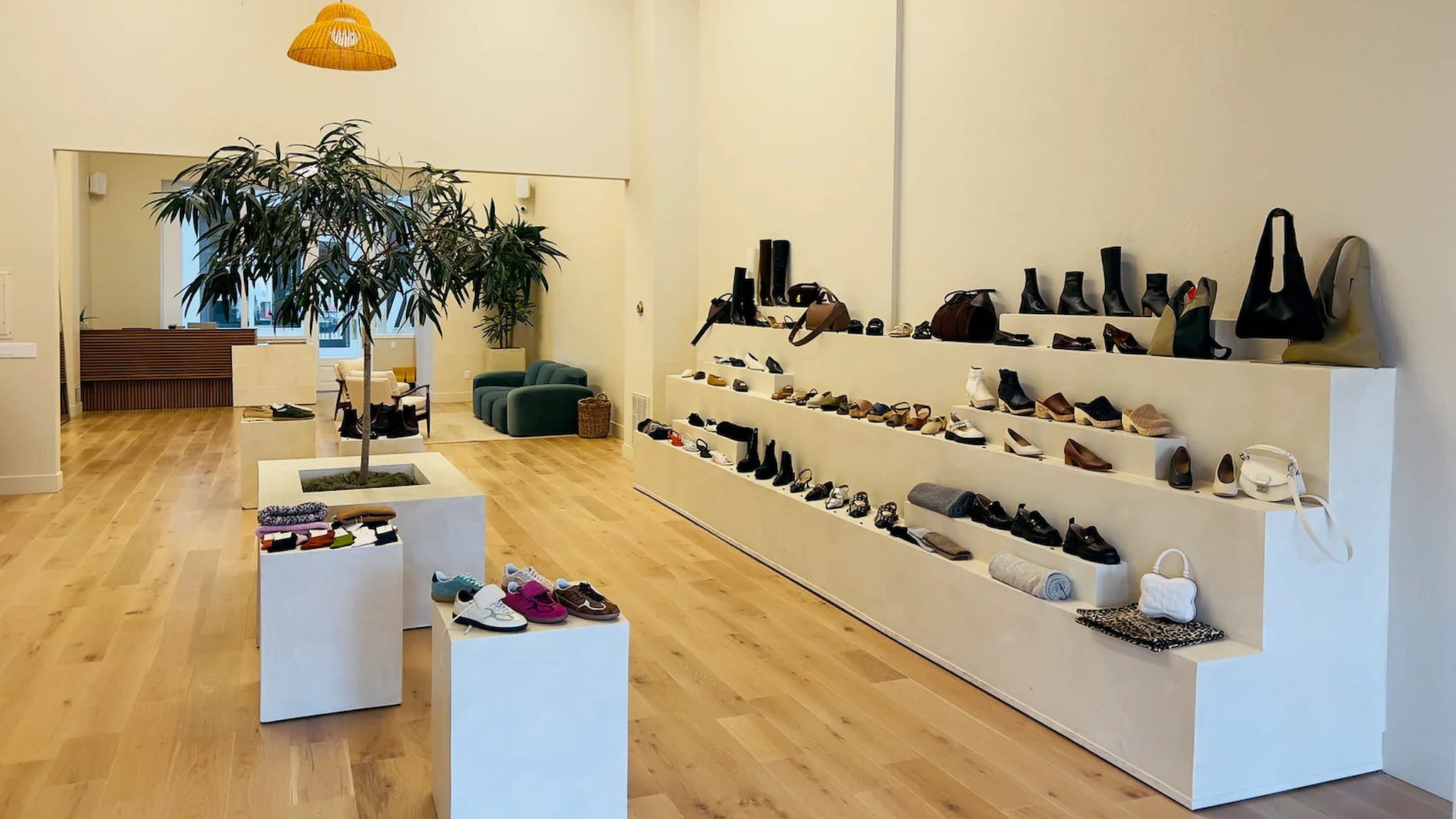Minimalist shoe store interior with wooden flooring.