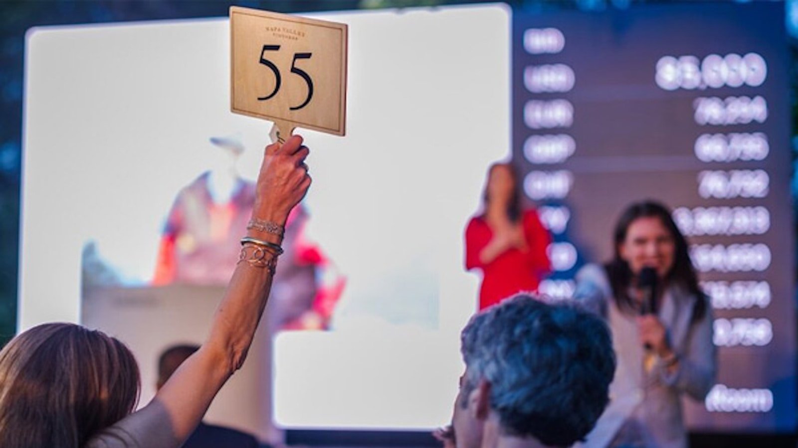 Auction in progress with bid number 55 displayed.