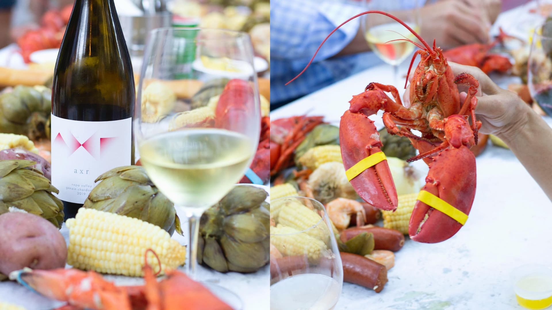 Wine with seafood, lobster, corn, and vegetables.