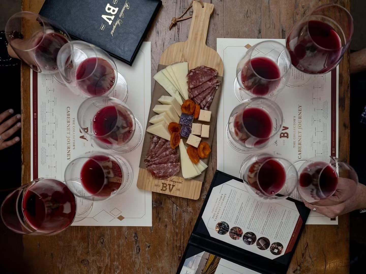 Red wine tasting with cheese and meat platter.