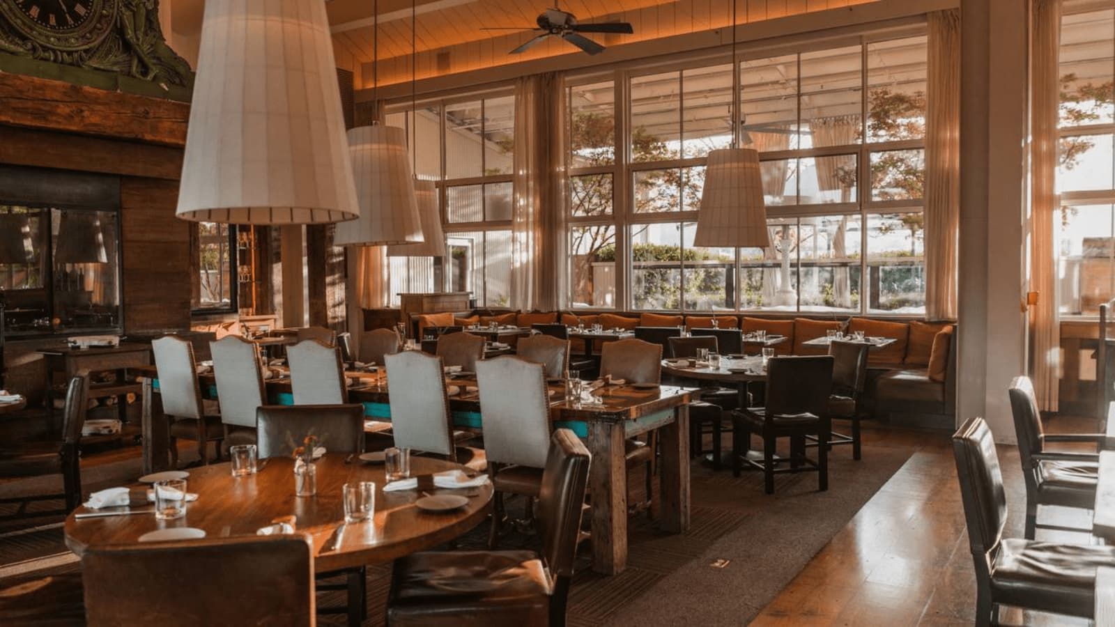 Cozy restaurant interior with wooden tables and chairs.