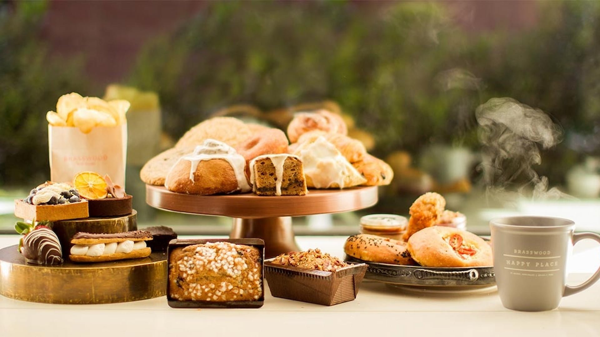 Assorted pastries and steaming coffee on display