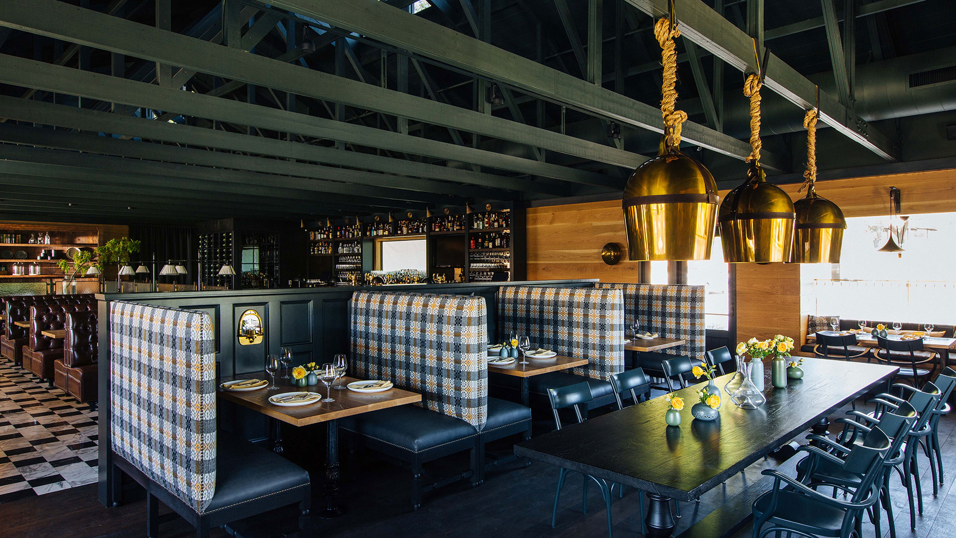 Chic restaurant interior with booths and bar area
