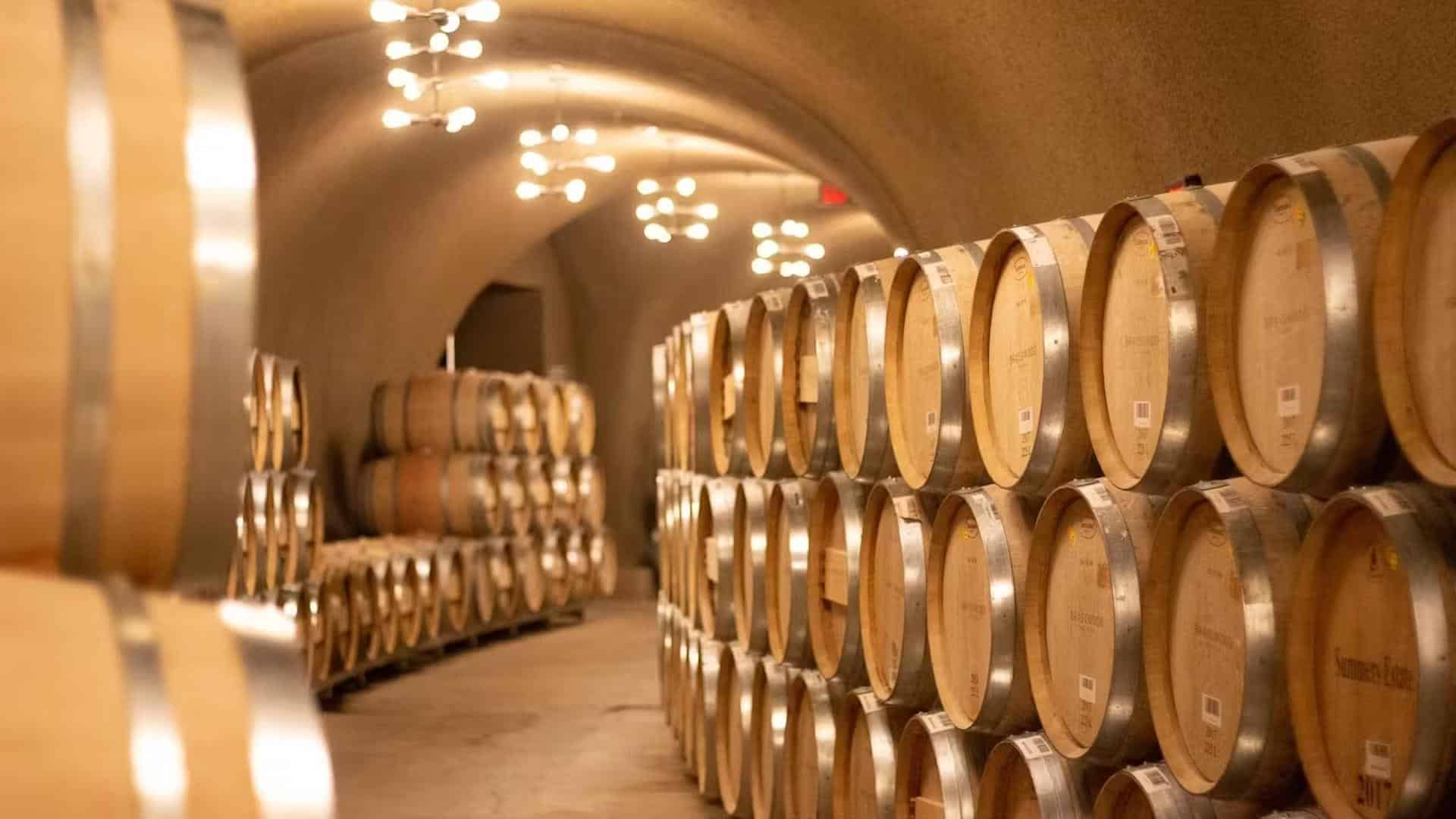 Wine barrels in a dimly lit cellar
