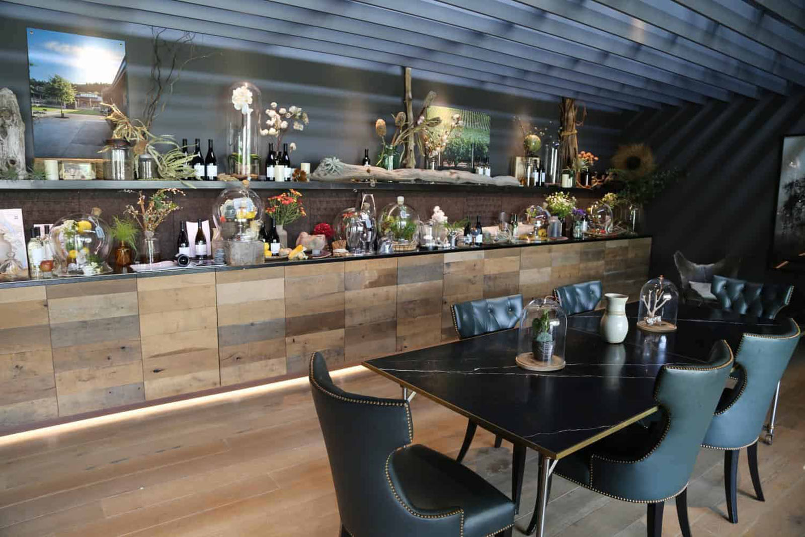 Modern restaurant interior with decor and tables.