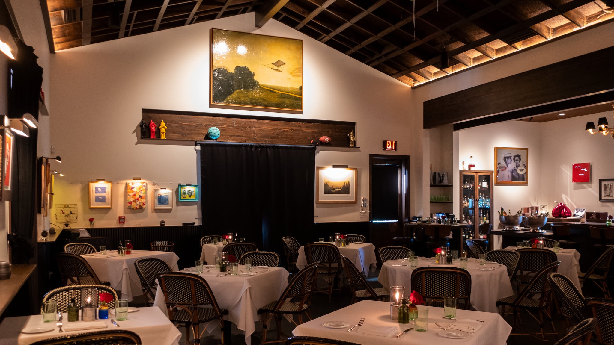 Cozy restaurant interior with white tablecloth tables