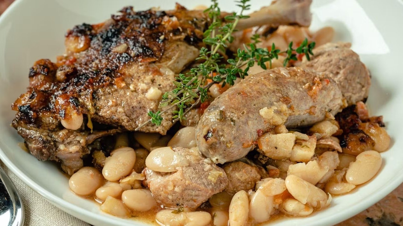French cassoulet with sausage, beans, and herbs