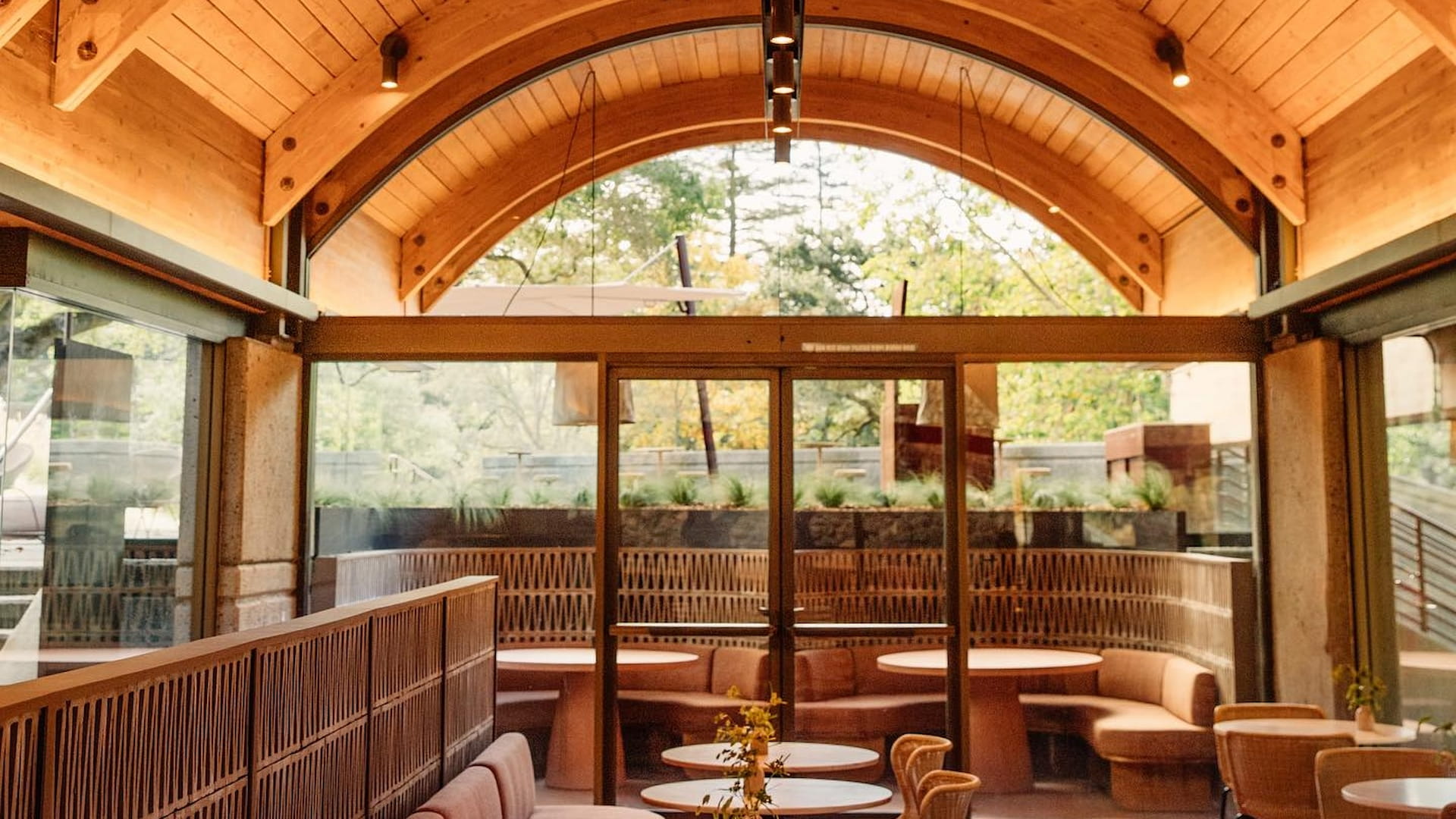 Cozy restaurant with wooden interior and seating.