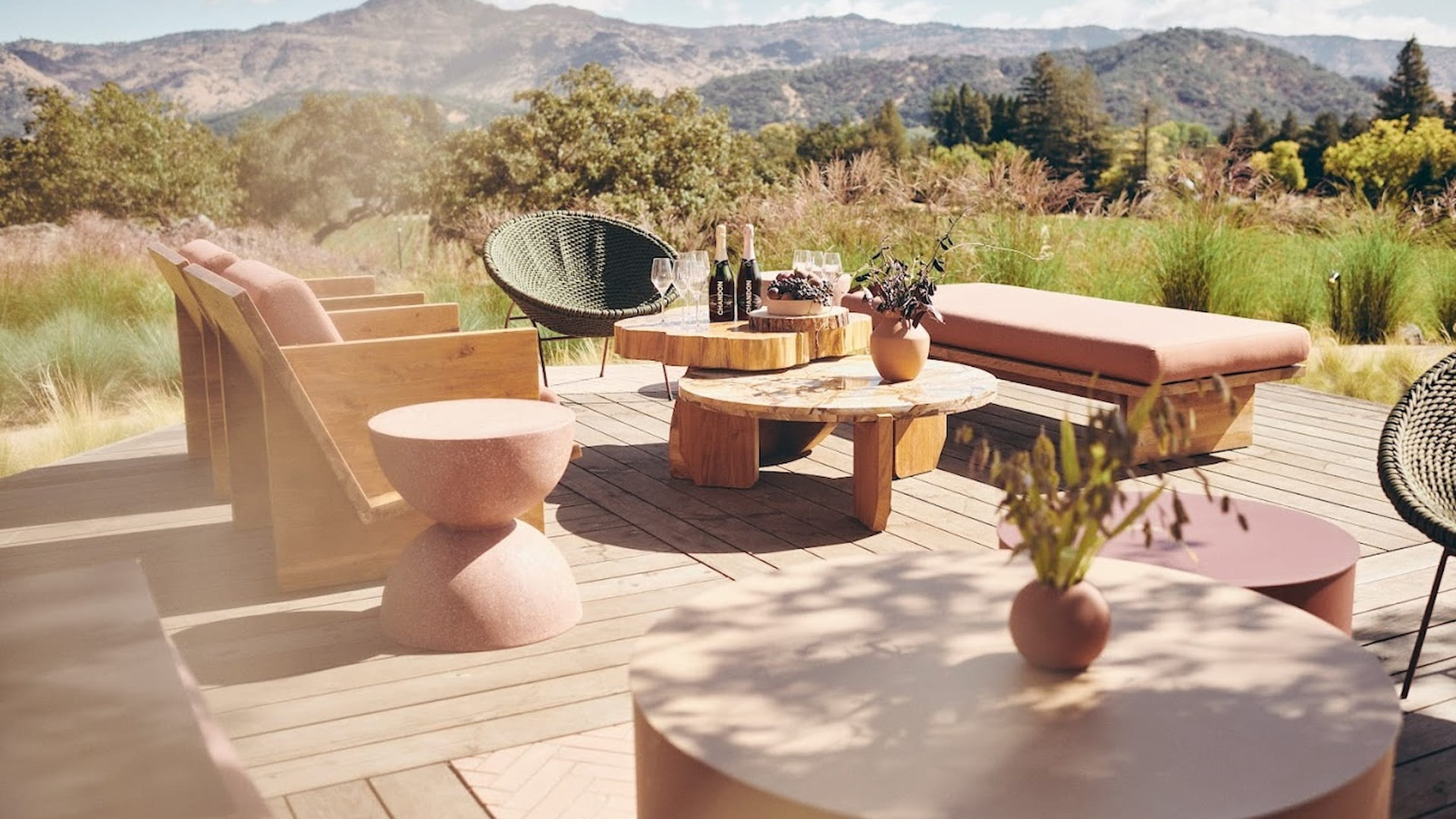 Outdoor patio with wooden furniture and scenic view
