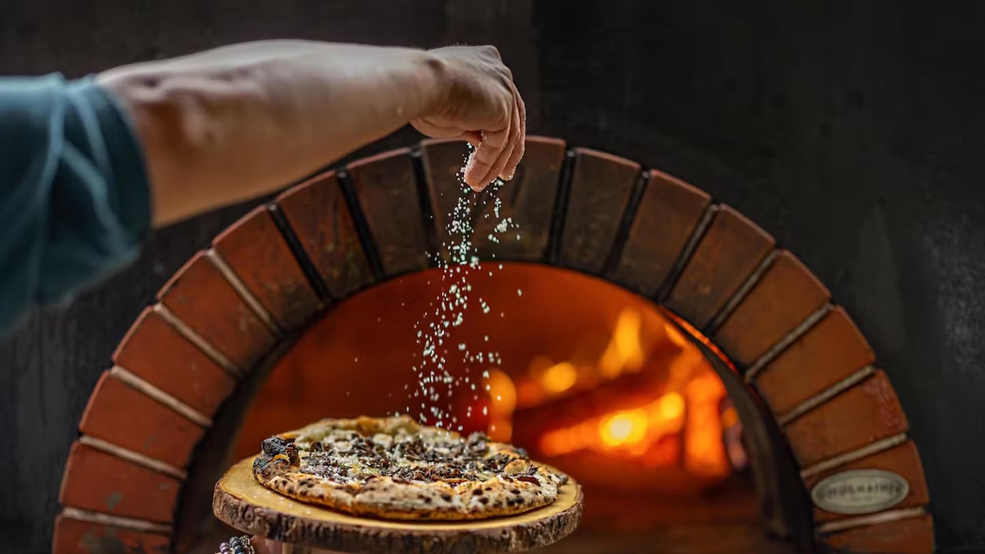 Baking pizza in a wood-fired oven