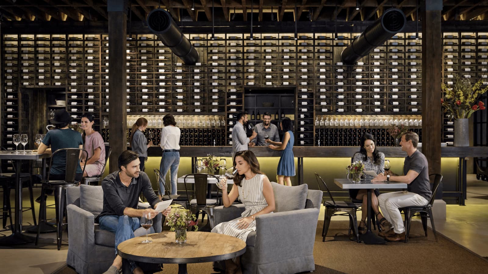 People enjoying drinks at a wine bar.