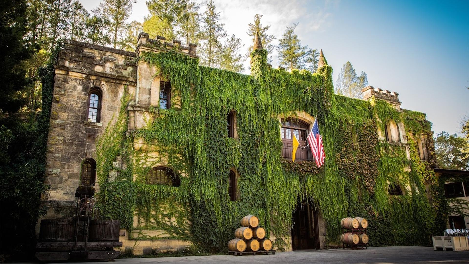 Historic winery building with ivy-covered walls.
