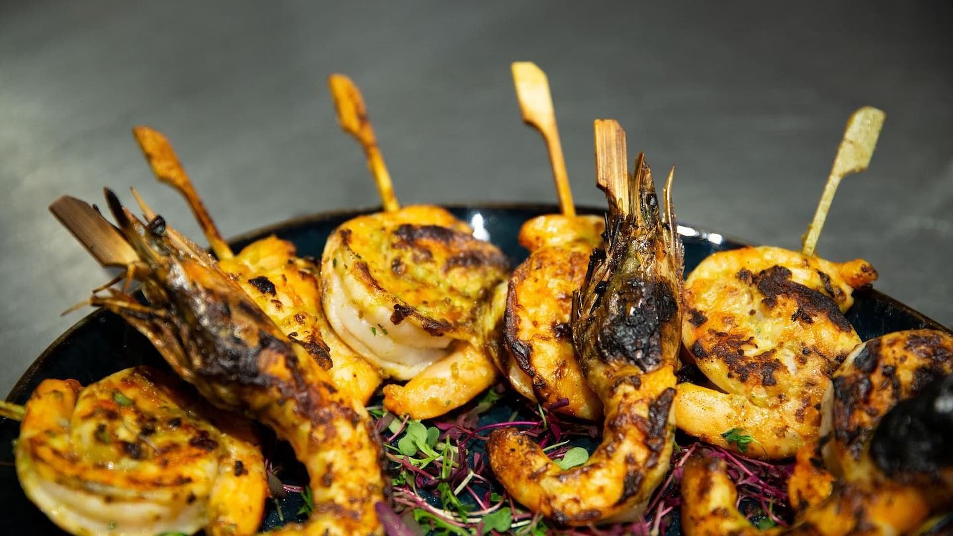 Grilled shrimp skewers with herbs and spices.
