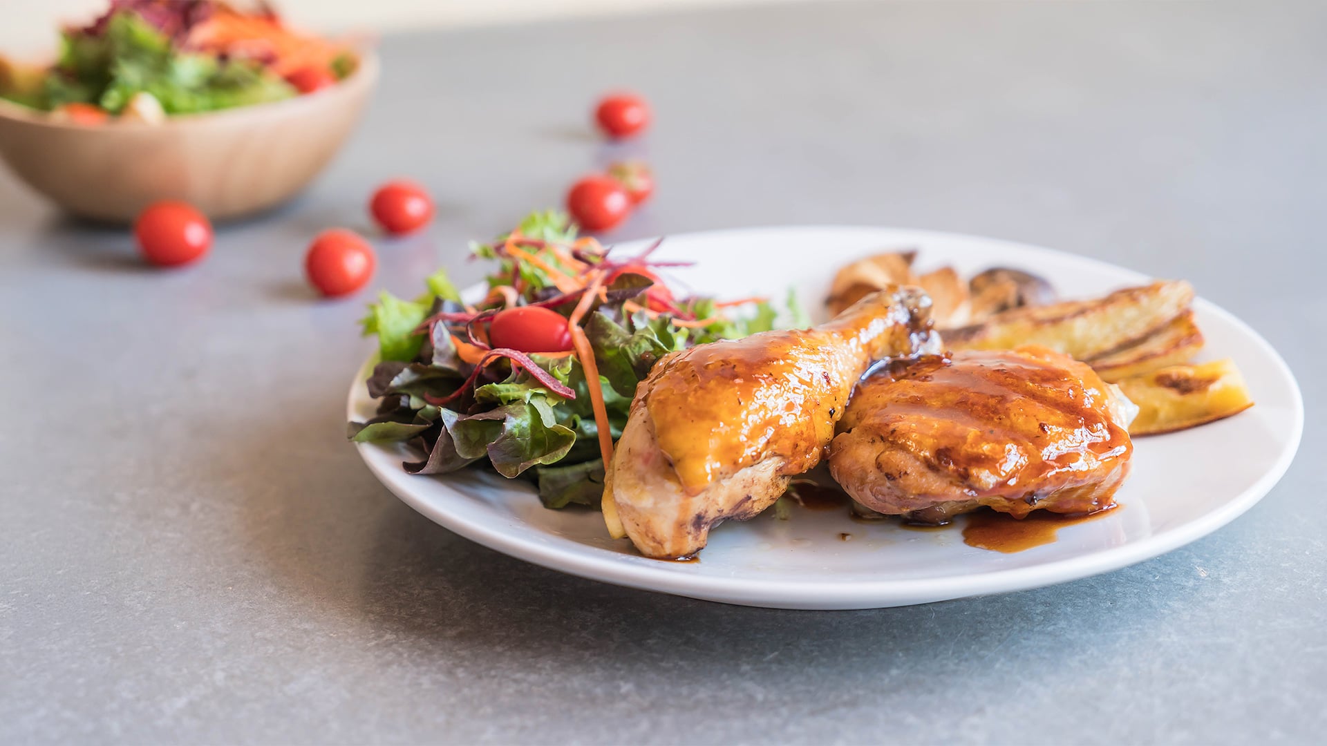 Roasted chicken with salad and grilled potatoes