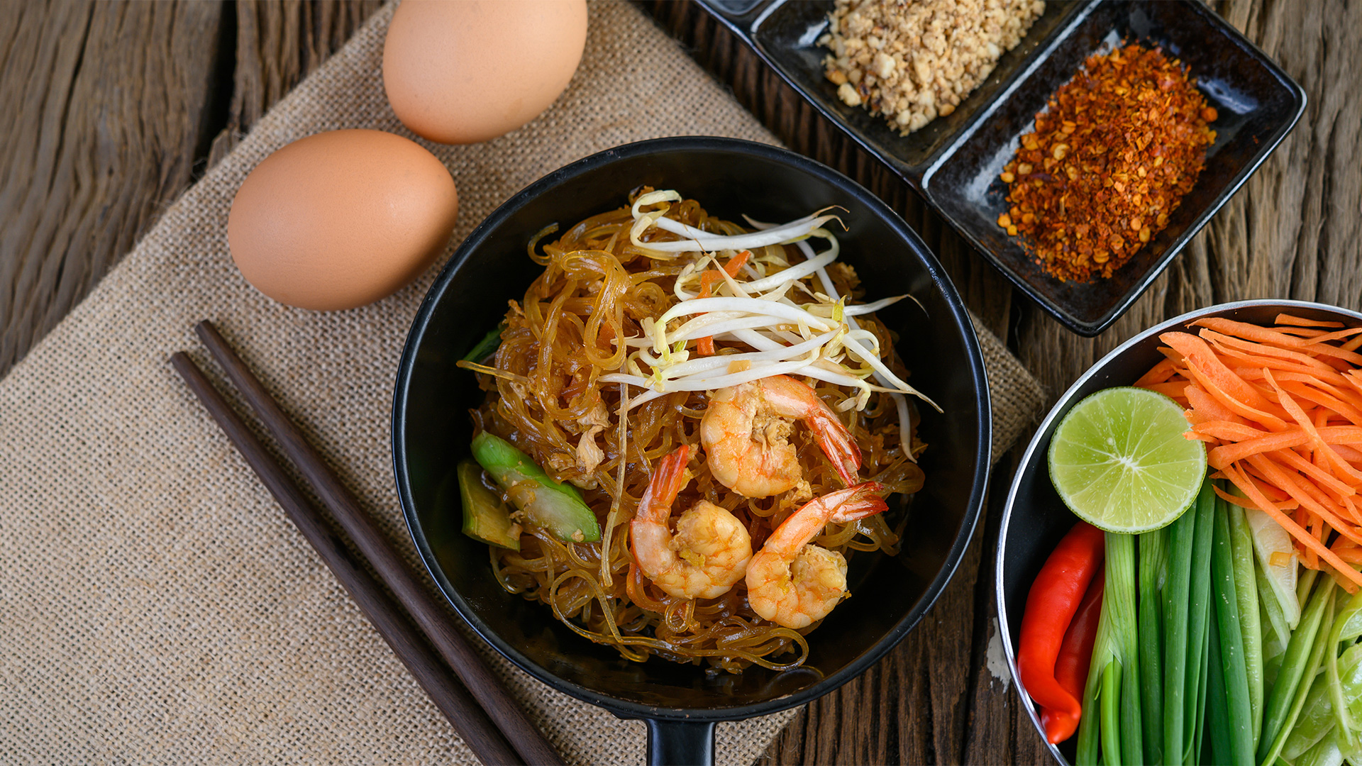 Shrimp pad thai with fresh vegetables and spices