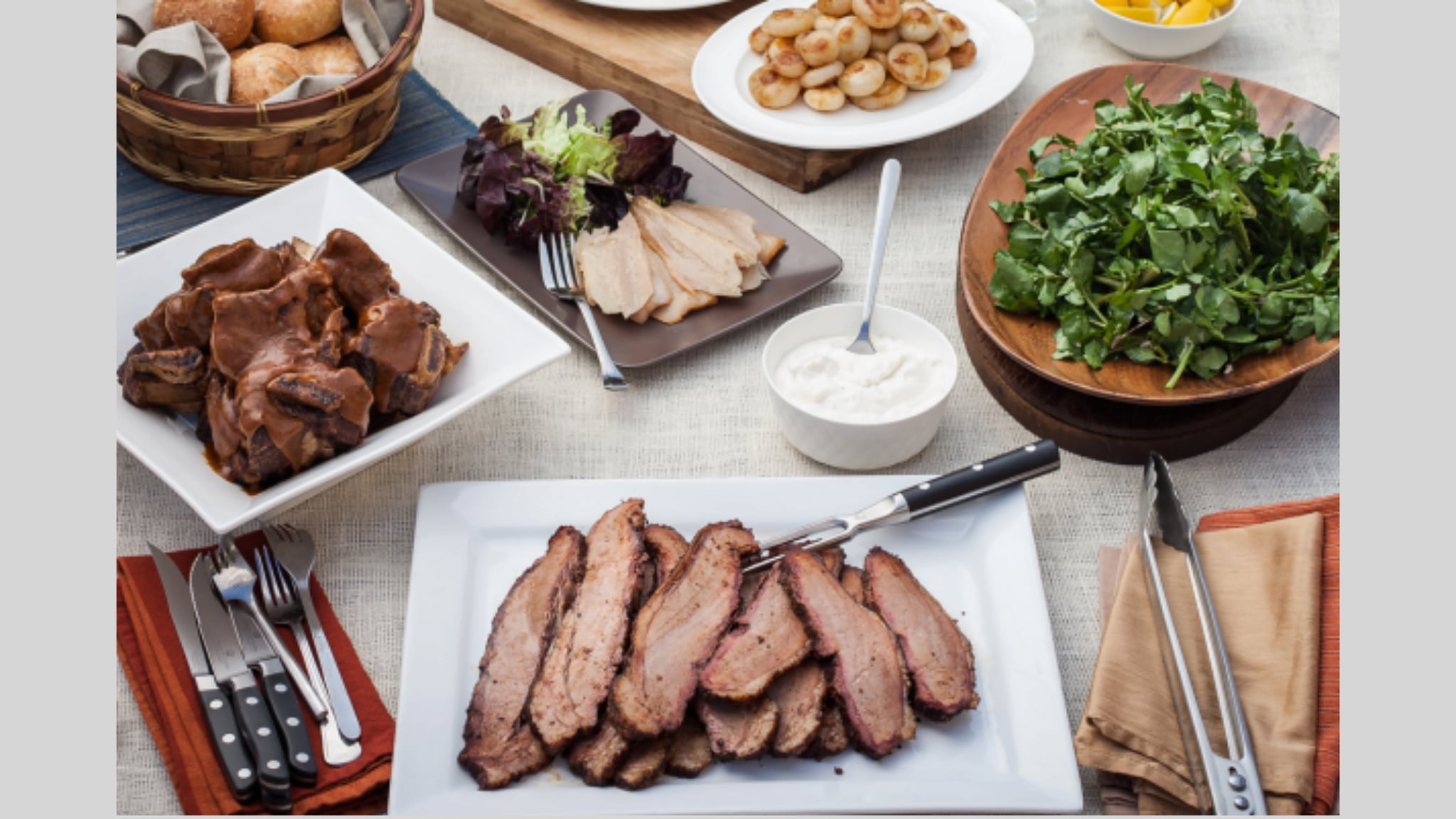 Sliced brisket with sides on dining table
