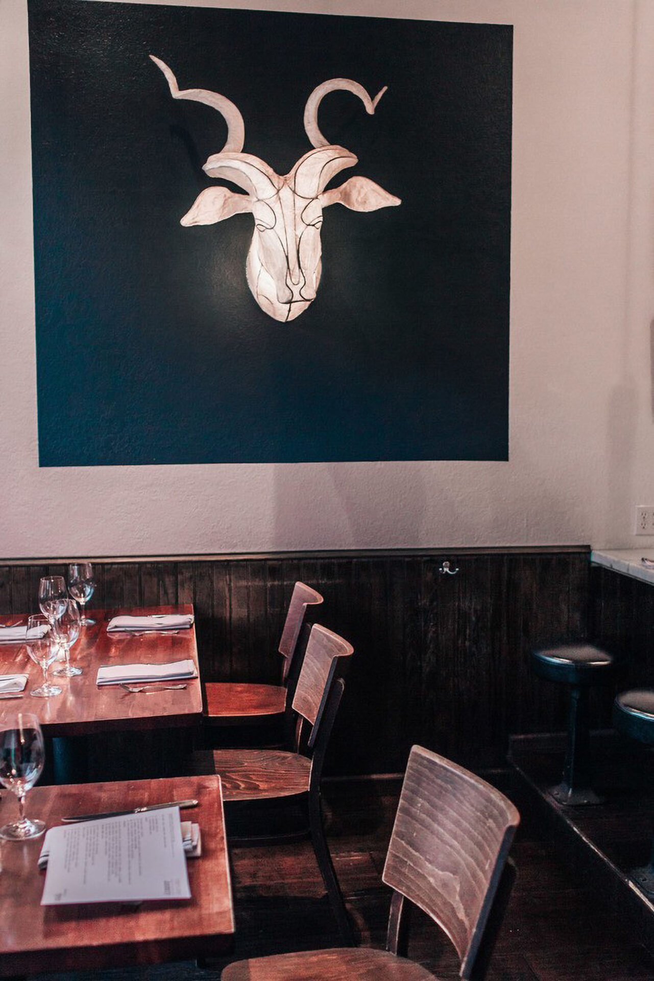 Empty restaurant with goat head decor