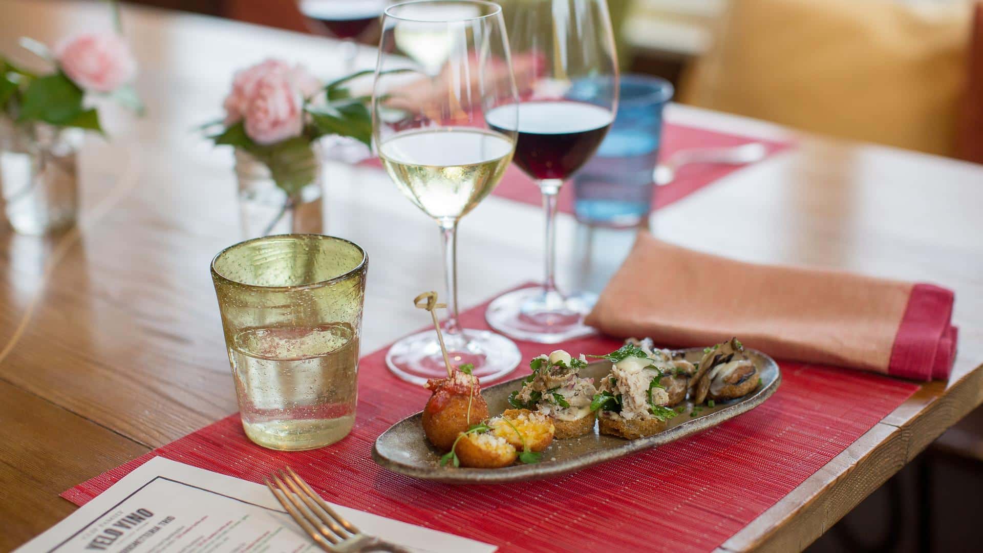 Wine glasses with appetizers on a restaurant table