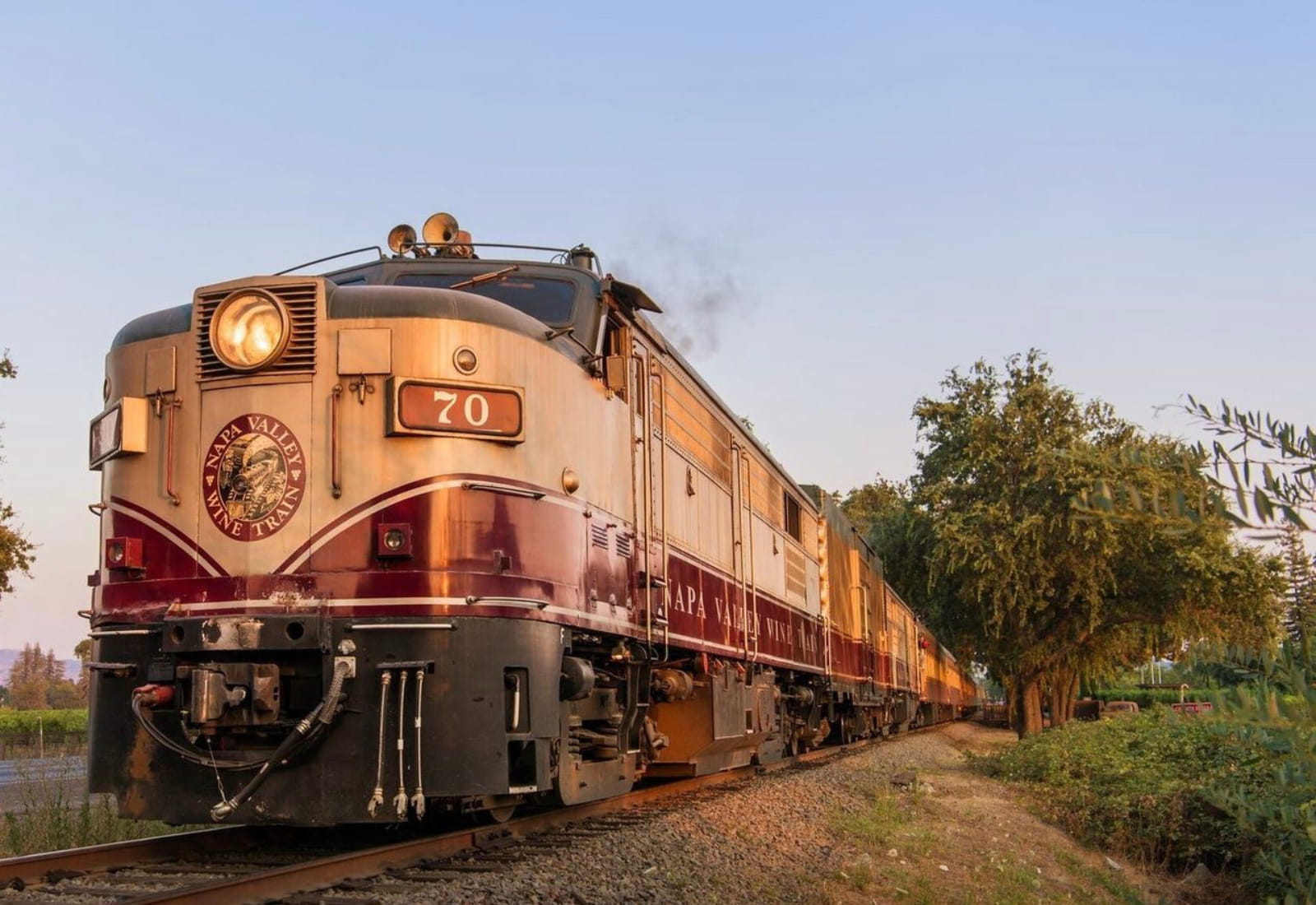 Napa Valley wine train traveling through scenic landscape.