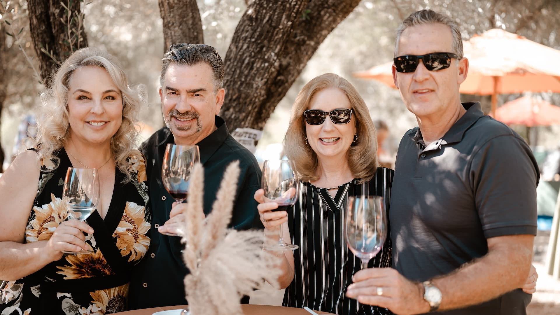 Group celebrating with wine outdoors