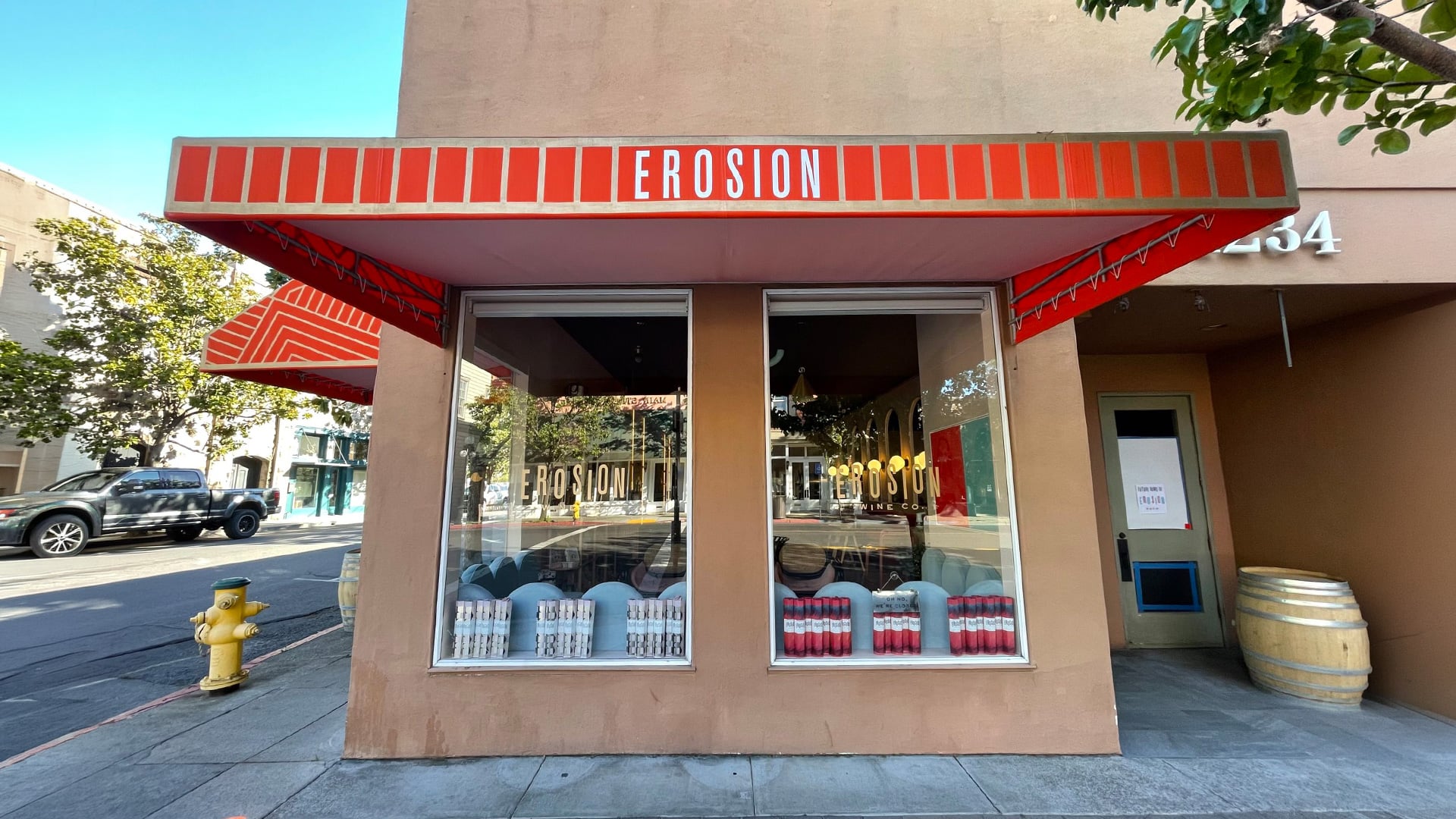 Erosion wine shop storefront with red awning
