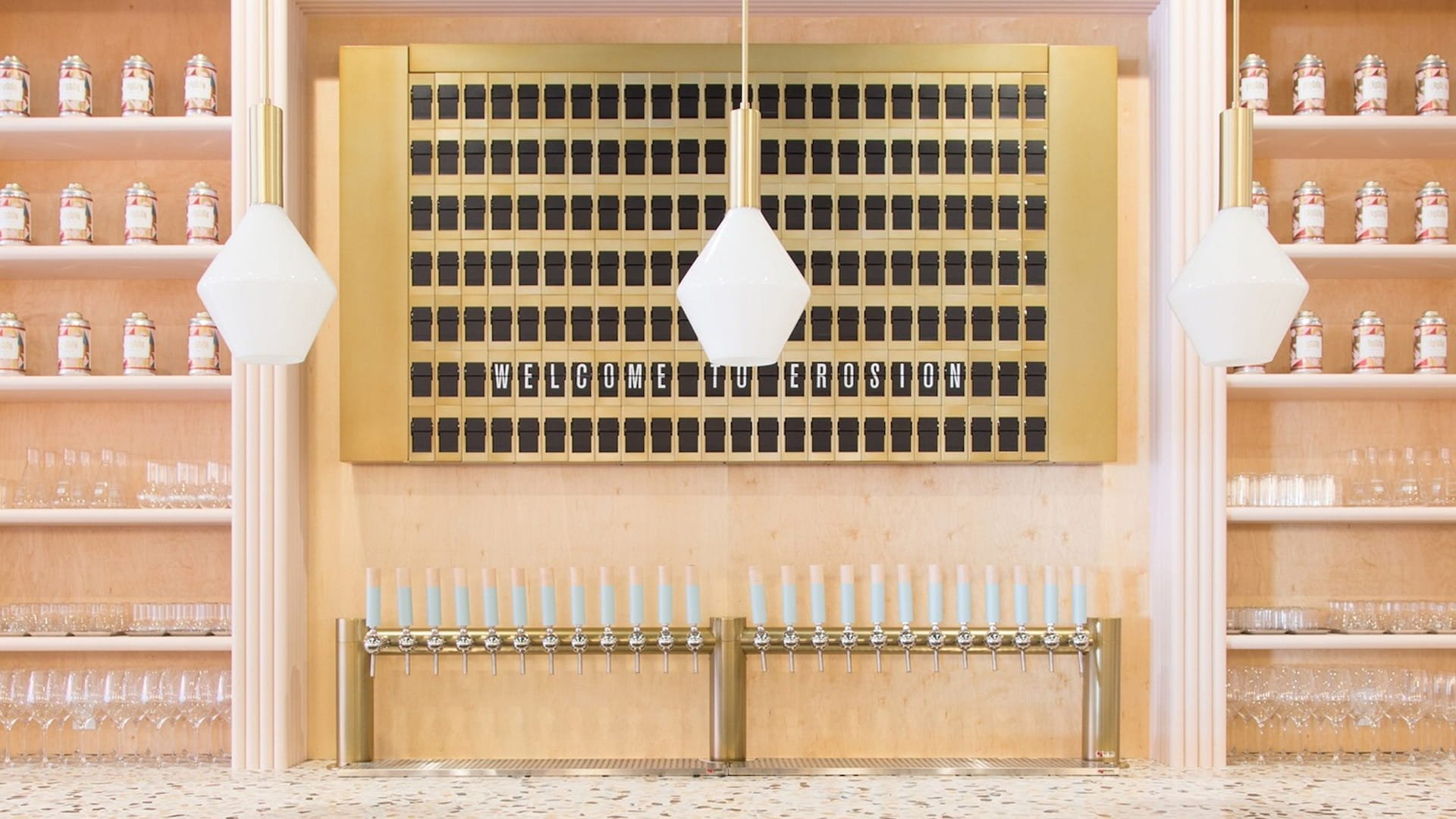 Ceramic jars and glasses in stylish display with lights.