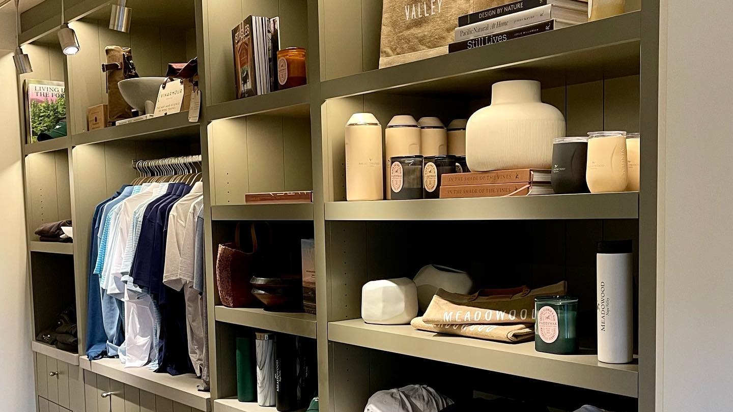 Organized shelves displaying clothes and decorative items.