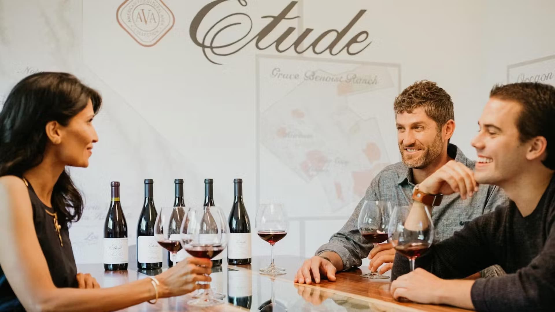 People enjoying wine tasting at Etude winery.