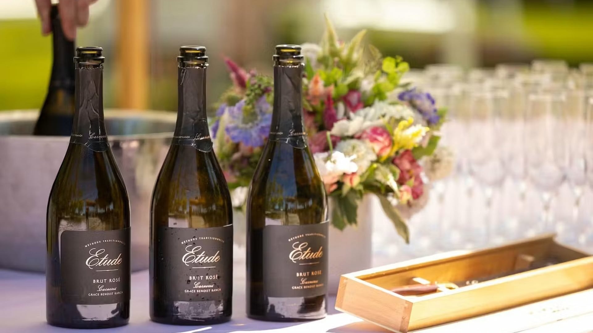 Three bottles of Brut Rosé on table