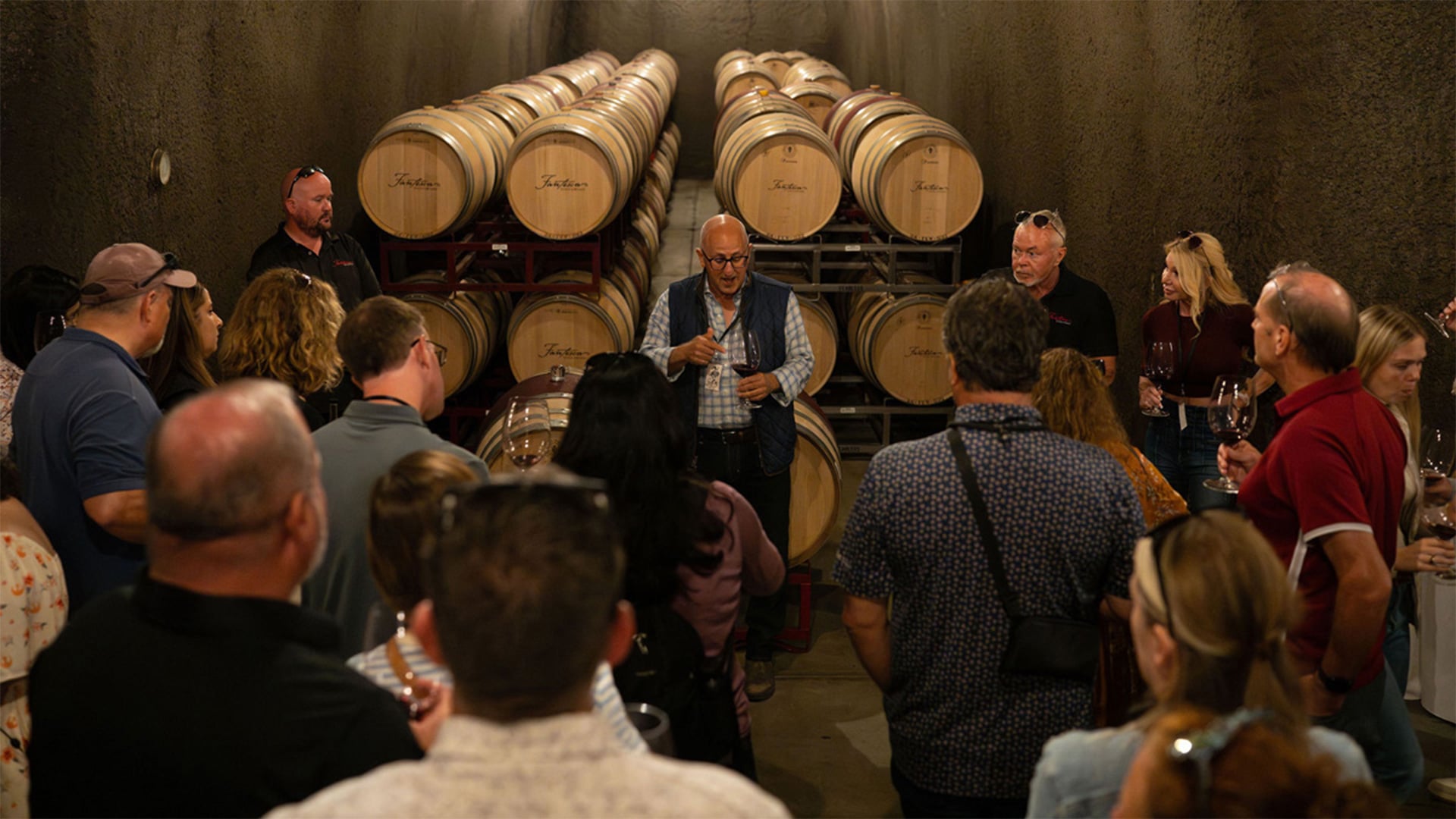 Wine tasting in barrel-filled cellar