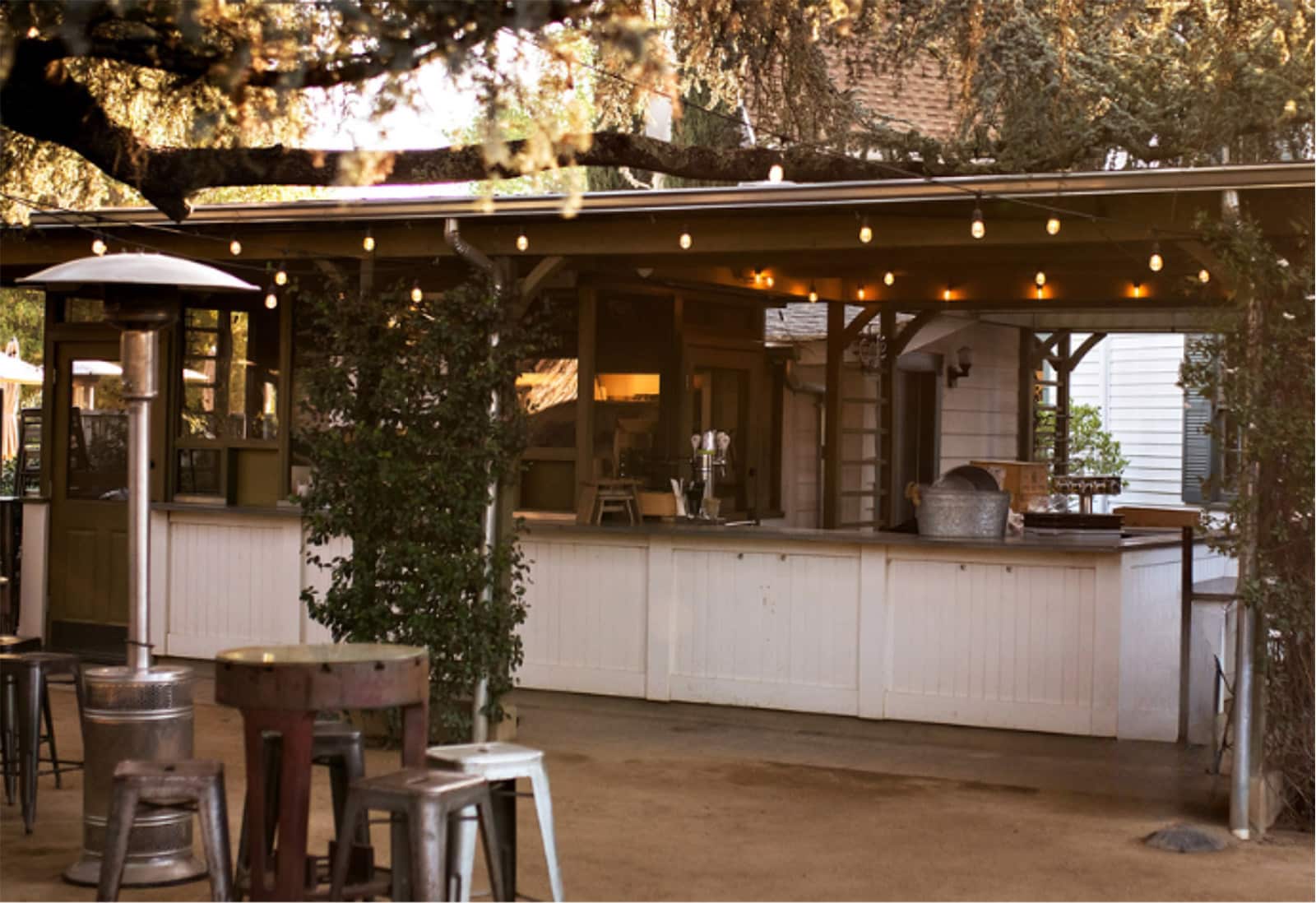 Rustic outdoor bar with string lights