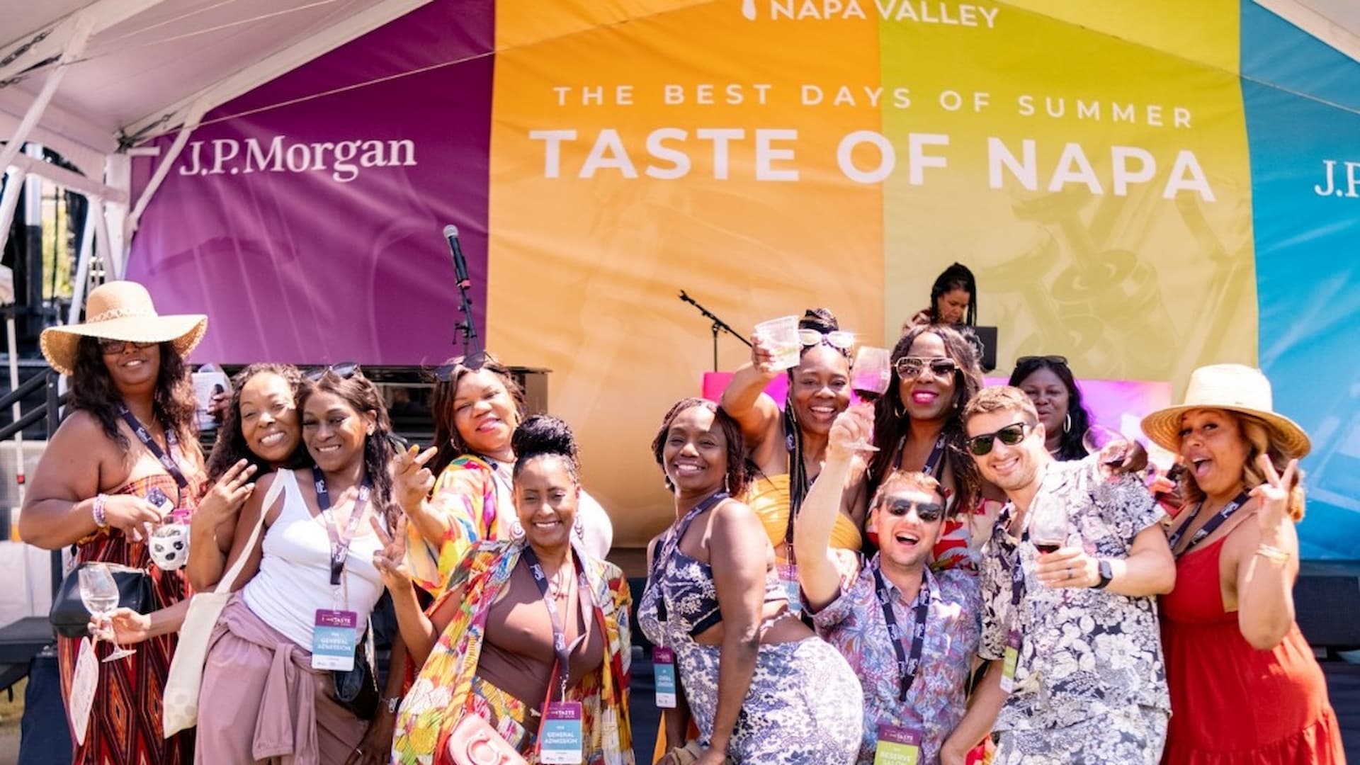 Group posing with wine glasses at Napa event