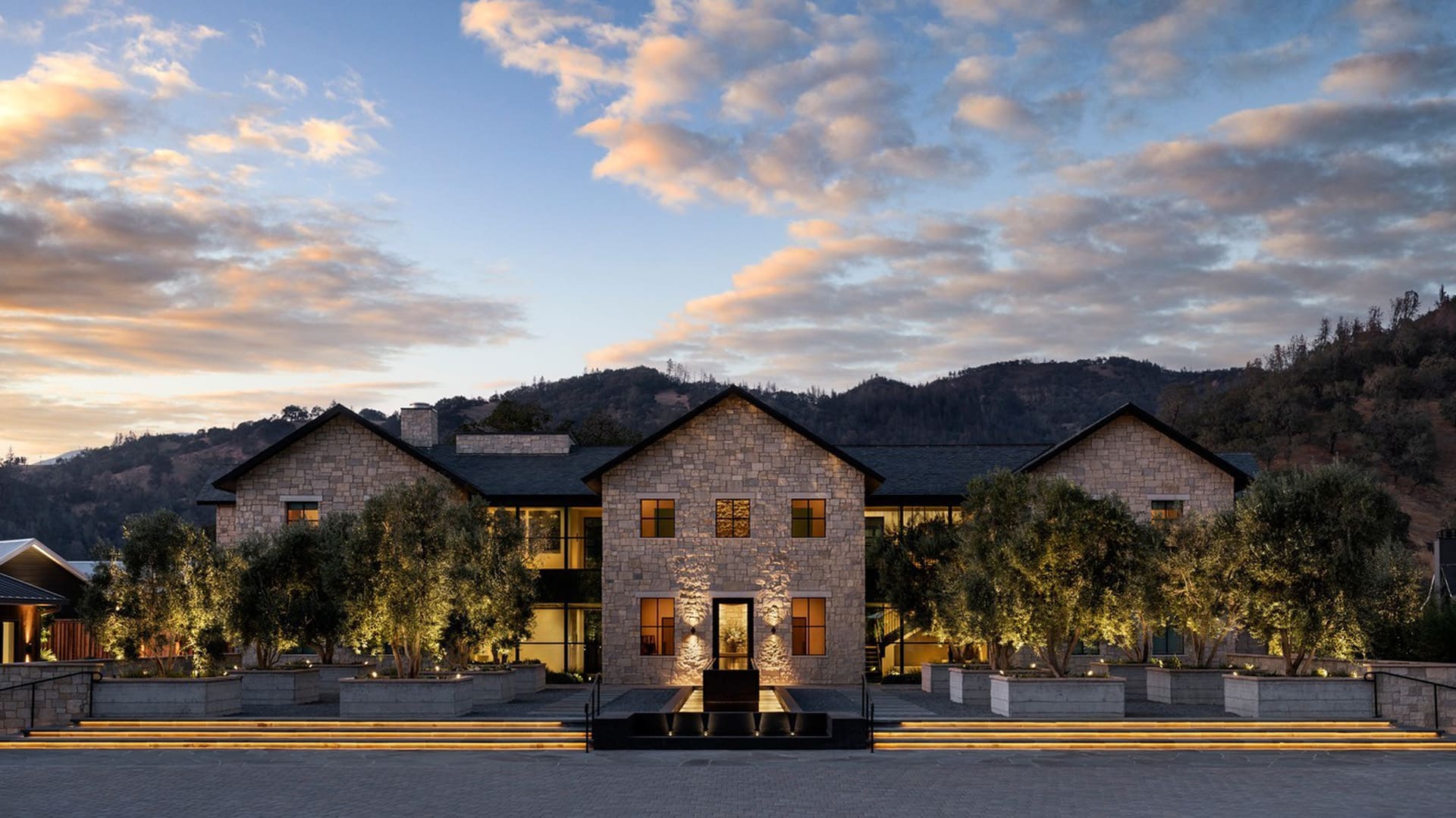 Luxury stone house with mountains in background