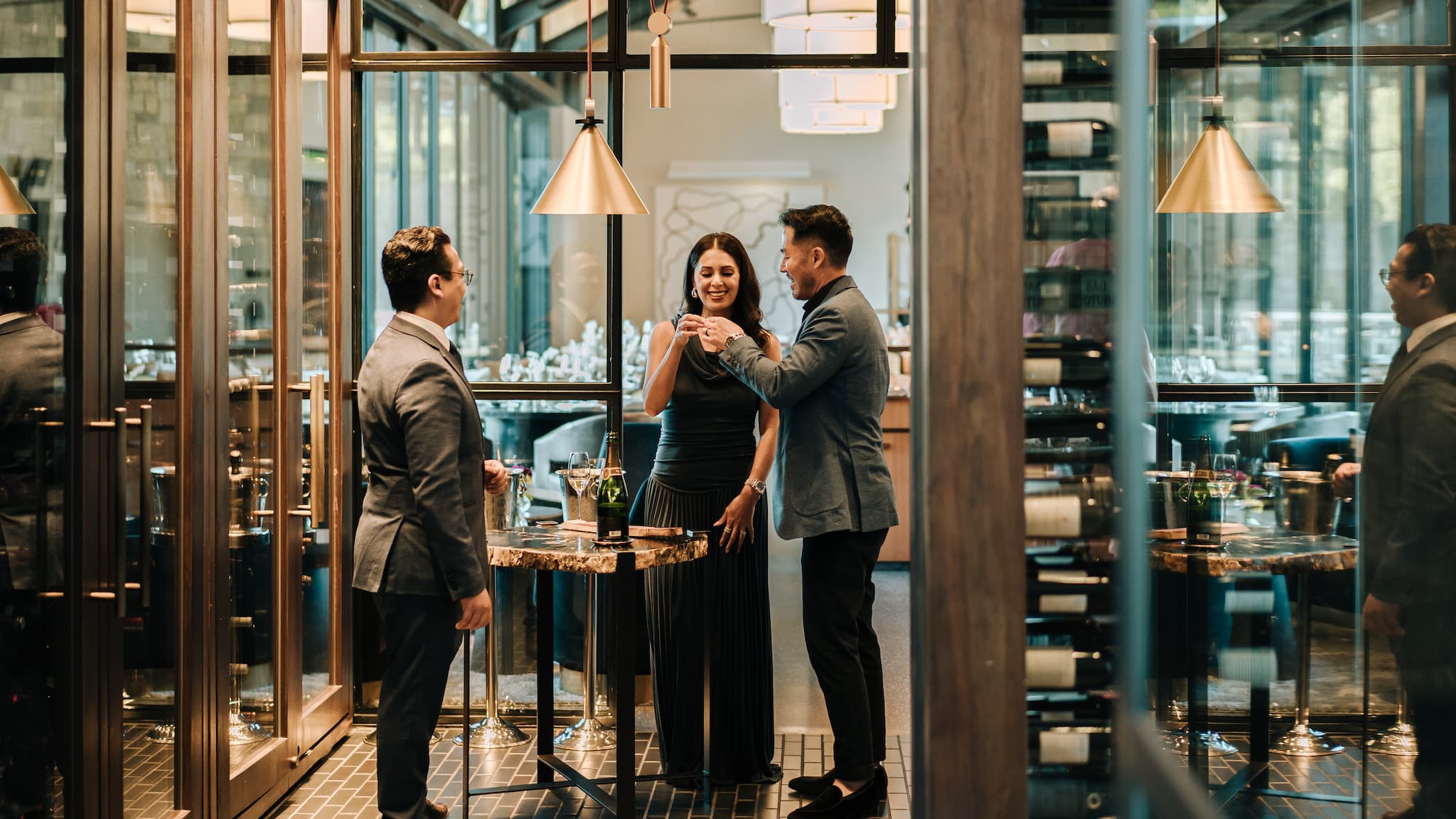 People enjoying drinks at elegant restaurant bar