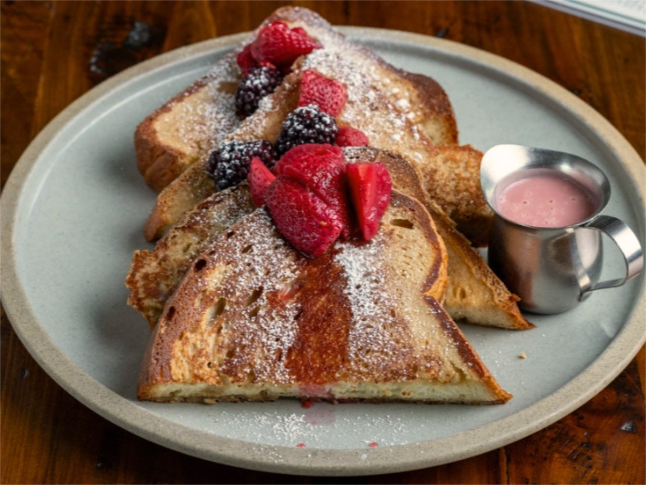 French toast with berries and powdered sugar