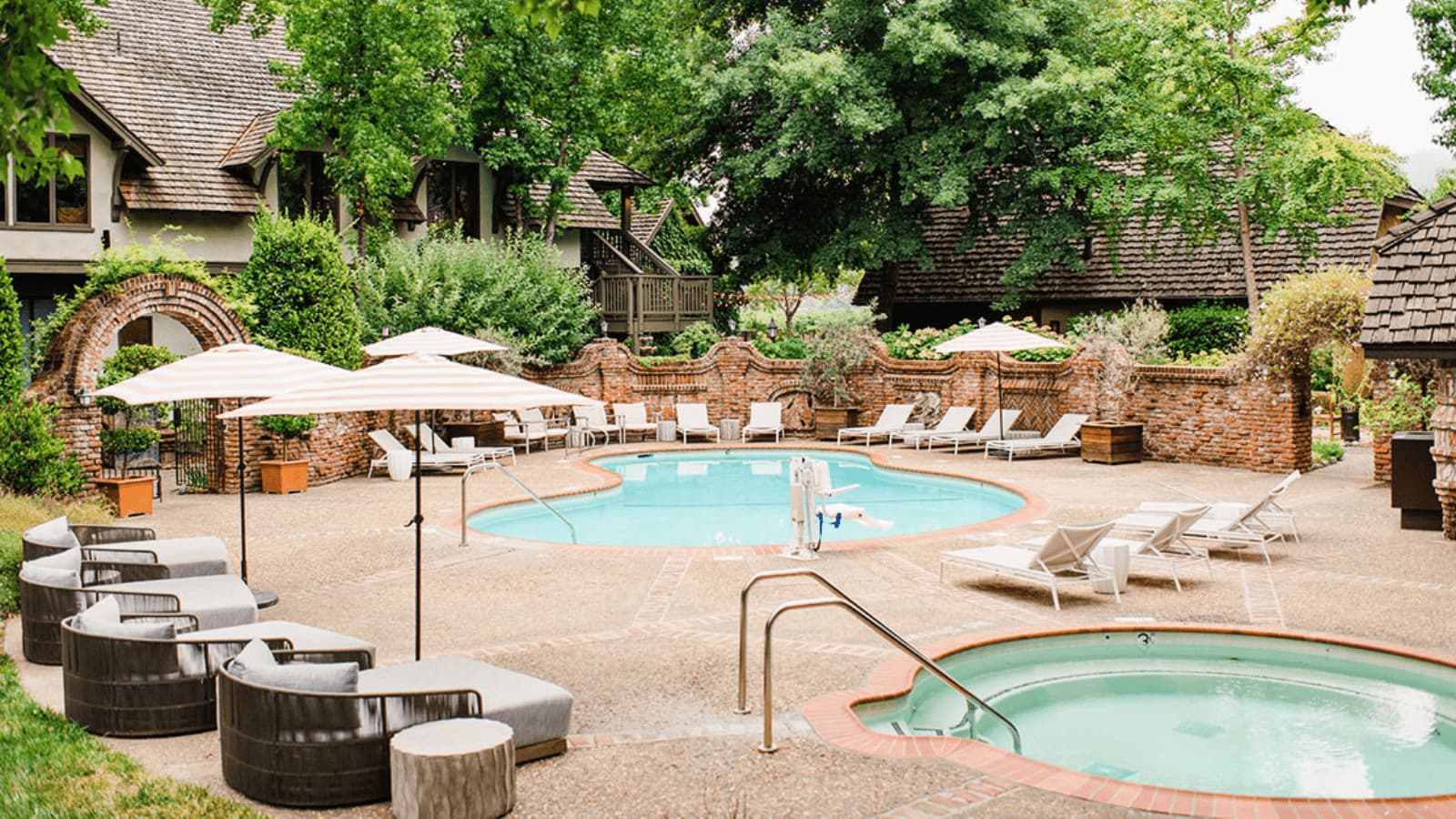 Luxury outdoor pool area with lounge chairs.