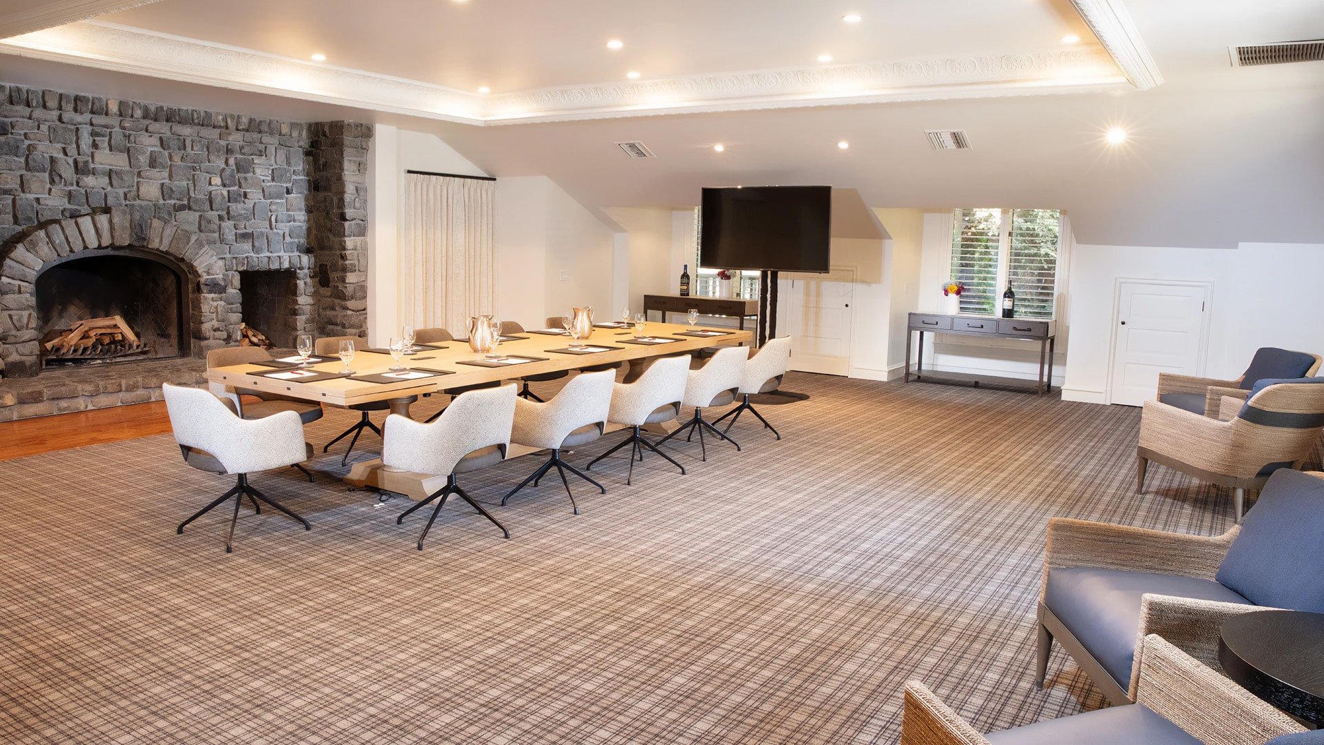 Modern conference room with stone fireplace