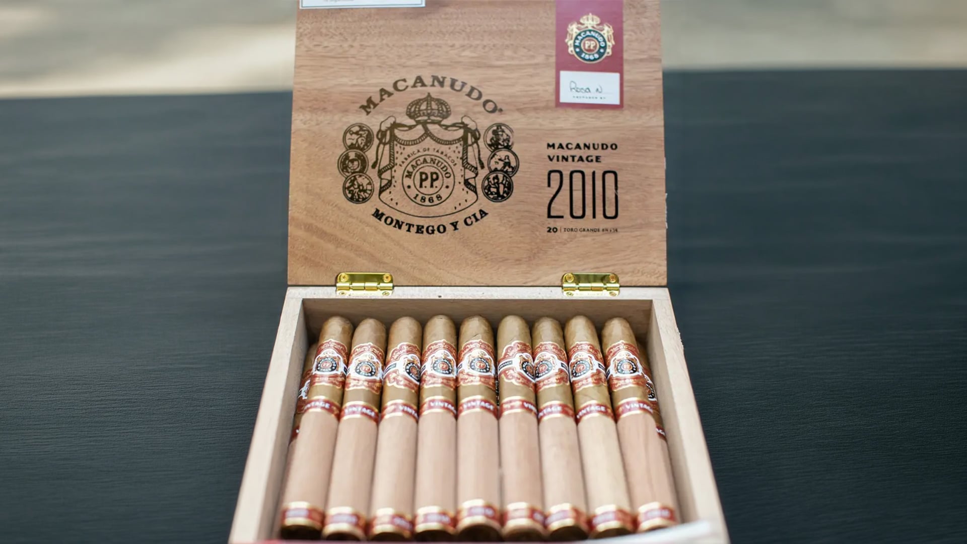 Open Macanudo Vintage 2010 cigar box with cigars