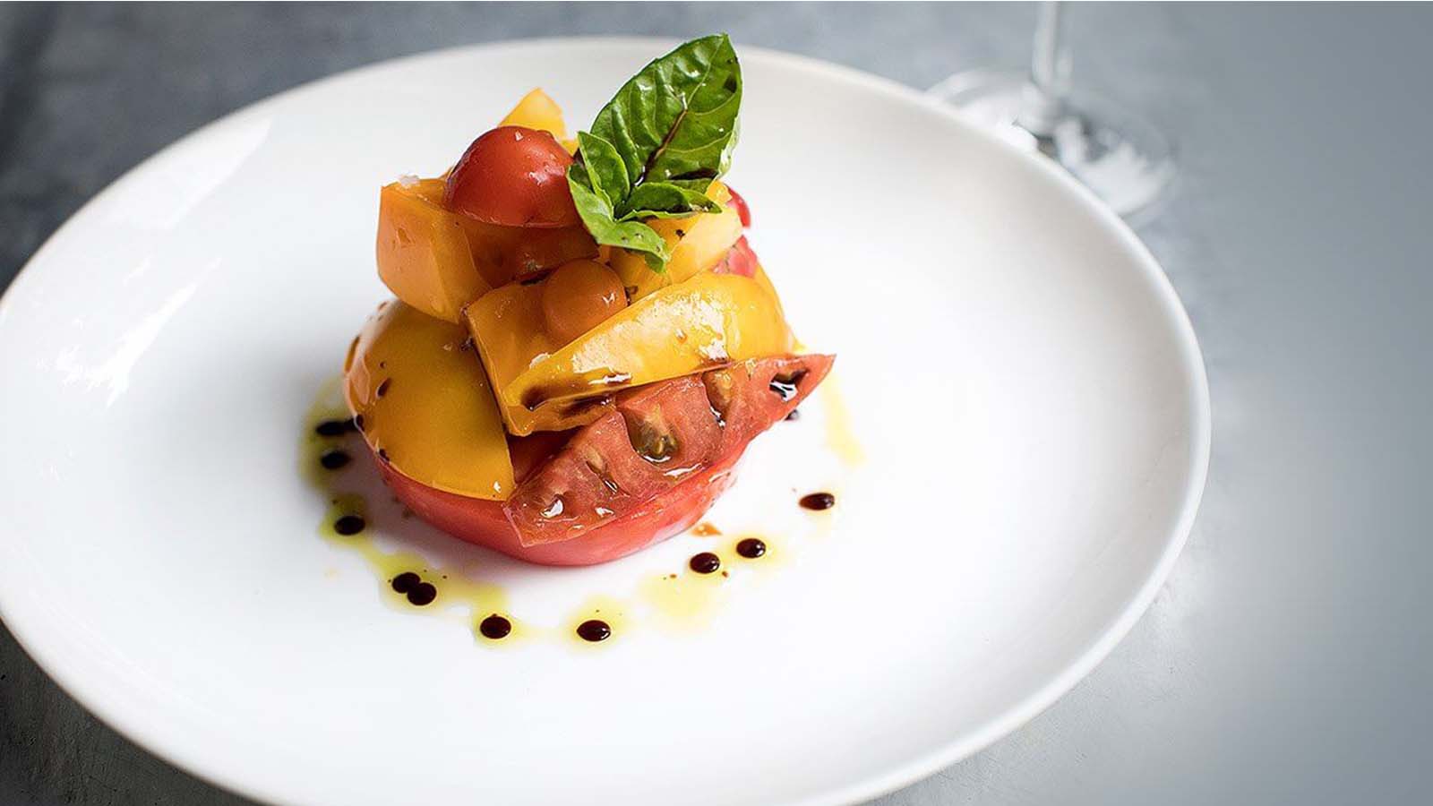 Heirloom tomato salad with basil and dressing