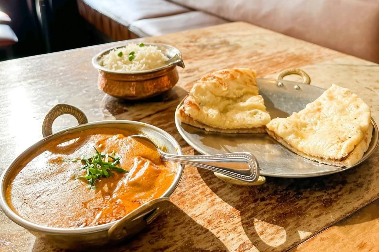 Butter chicken with naan and rice