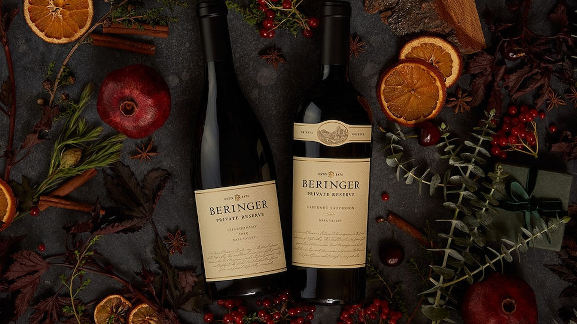 Beringer wine bottles with fruits and leaves decor.