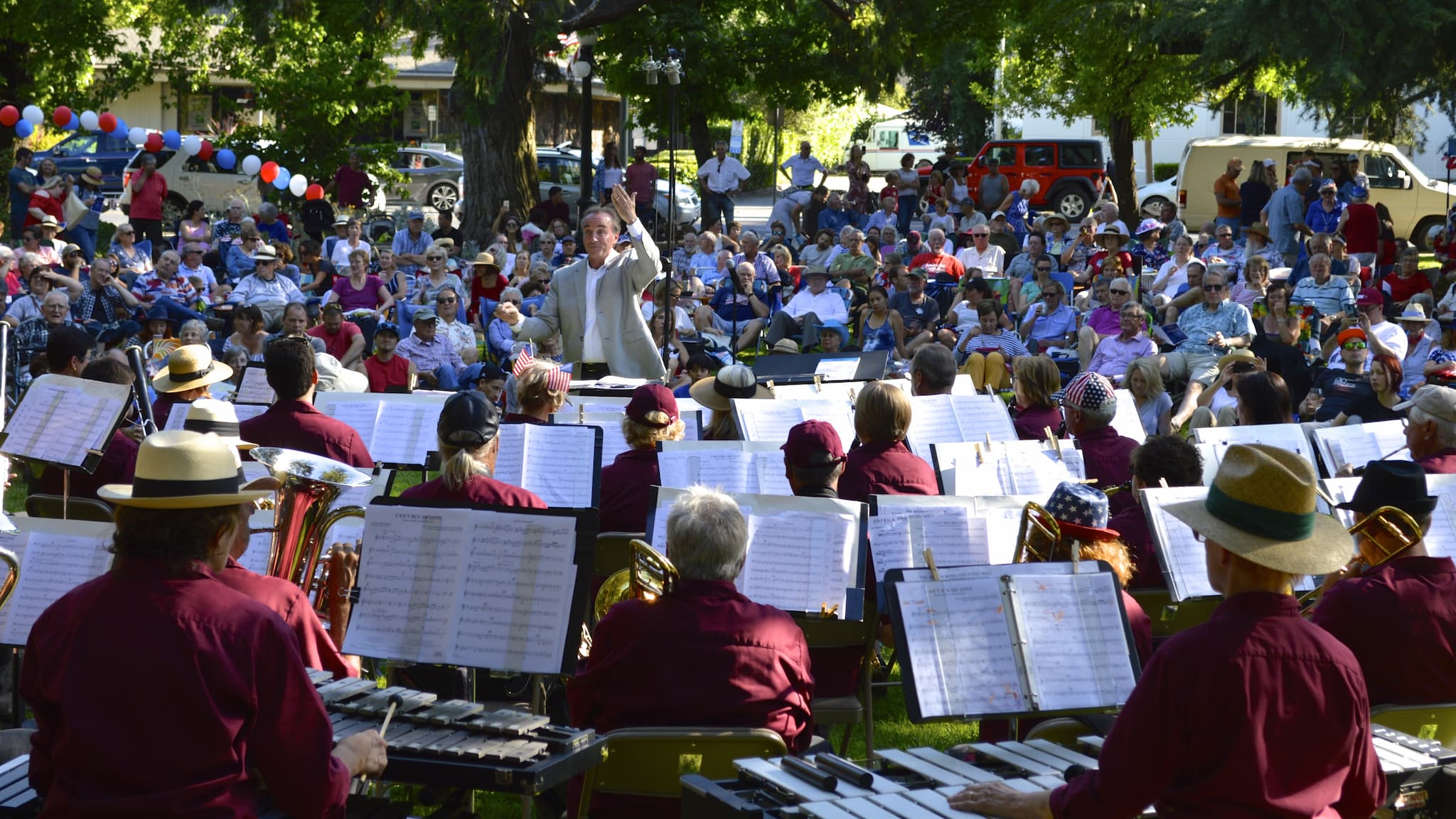 Community band performing outdoor concert in park