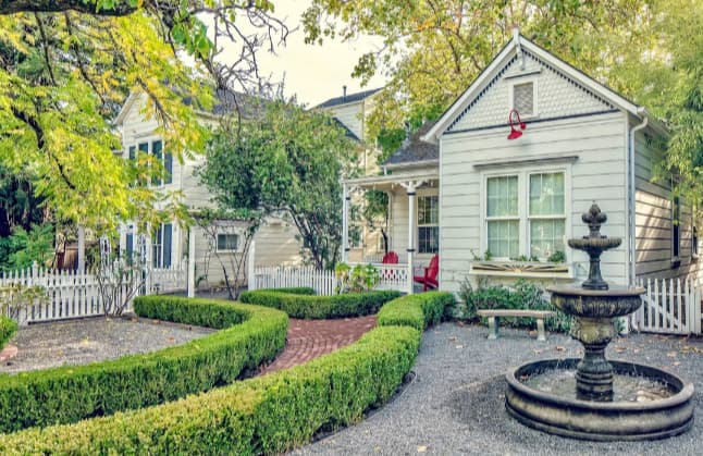 Charming cottage with fountain and manicured garden