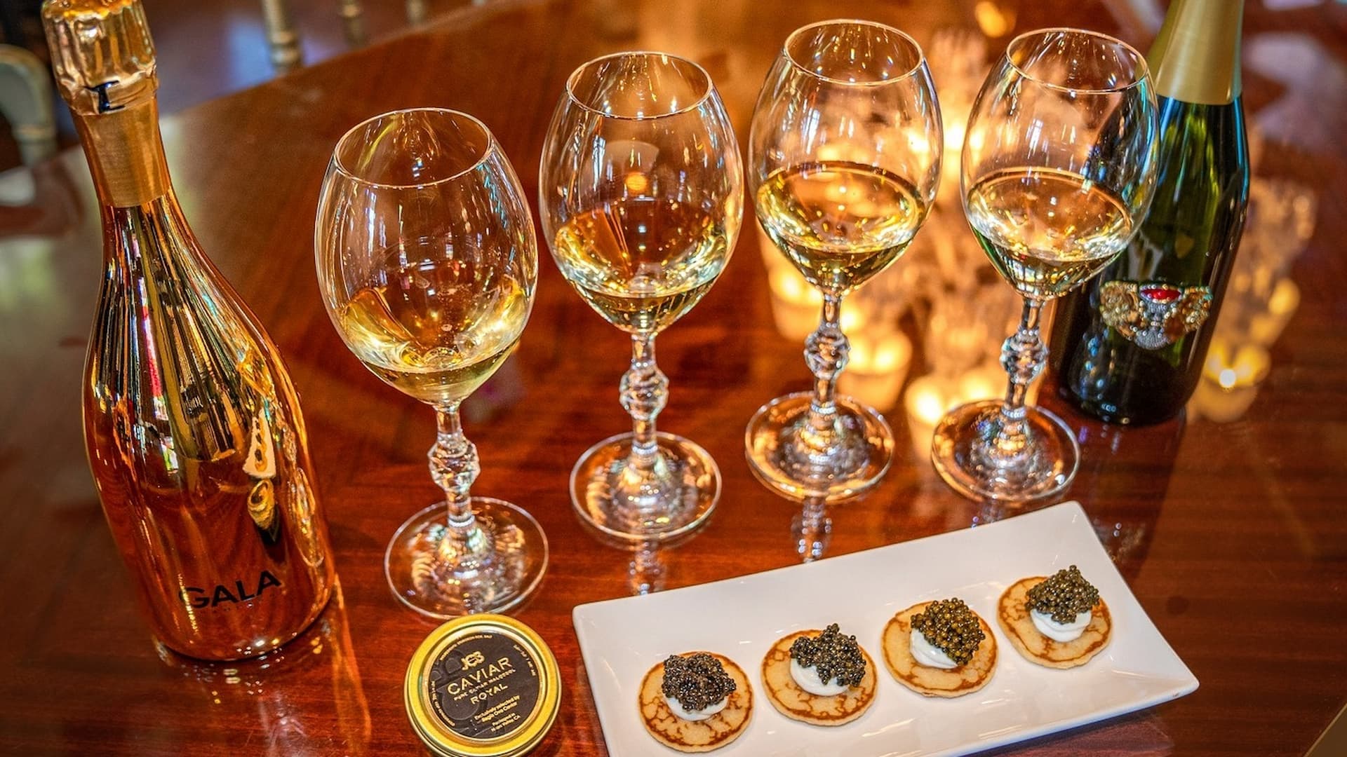 Champagne with caviar appetizers on elegant table.