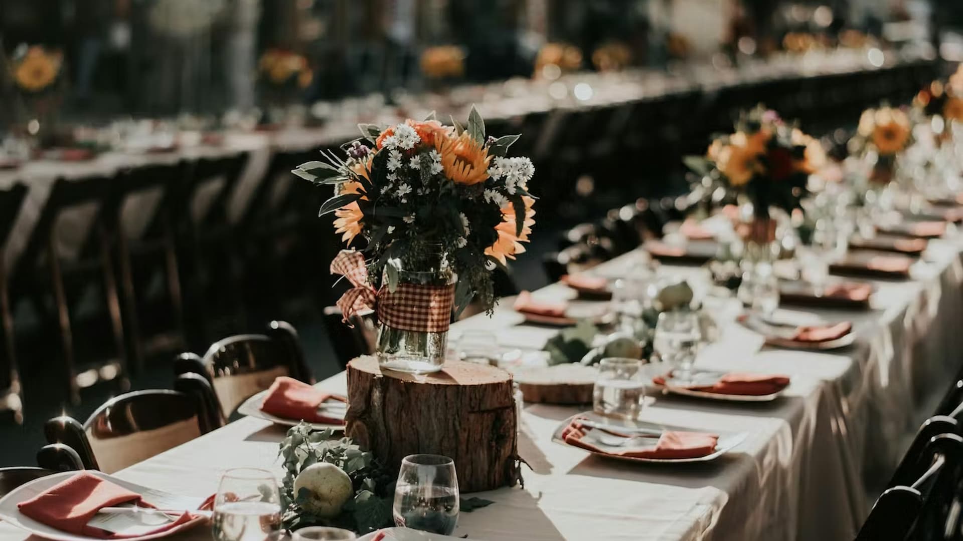 Rustic outdoor table with sunflowers and place settings