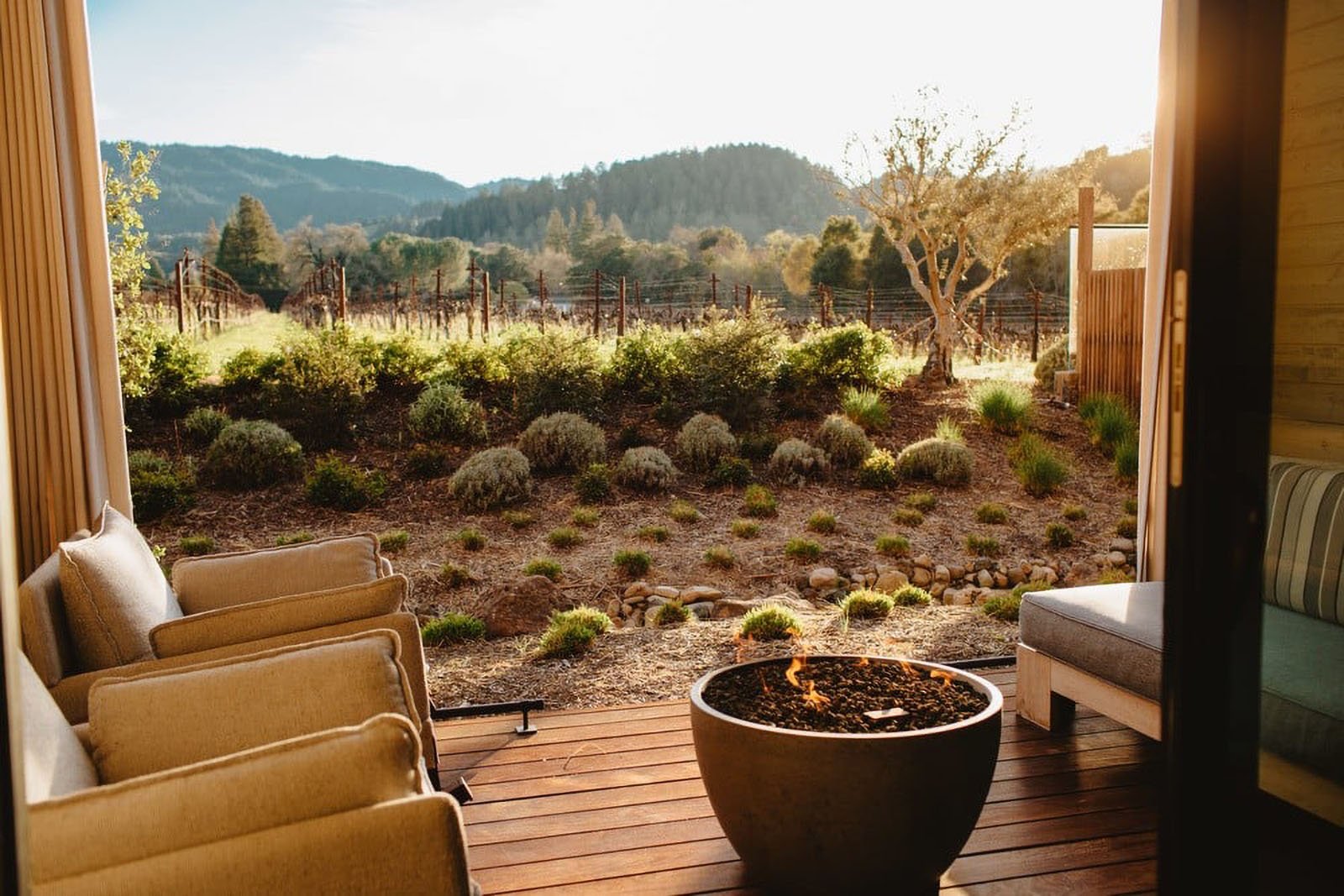 Patio overlooking vineyard and mountains at sunset