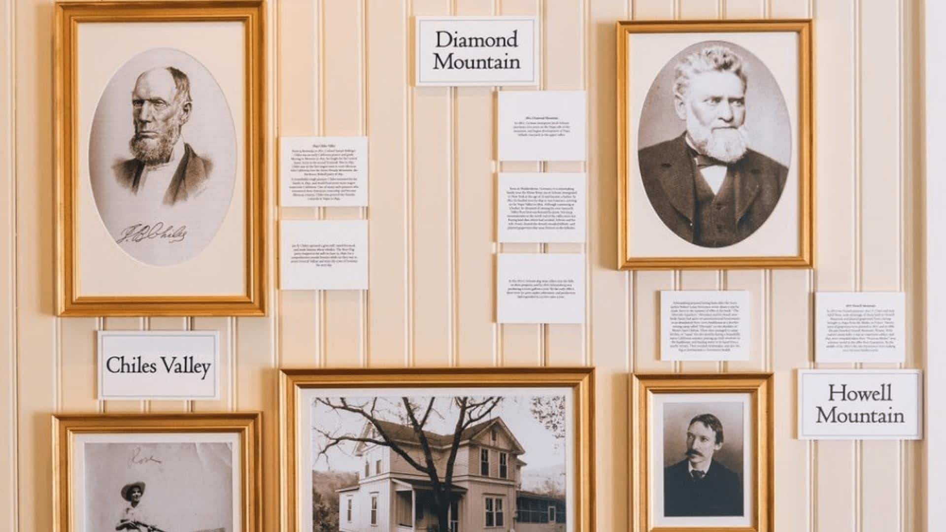 Historic portraits and text in gold frames.